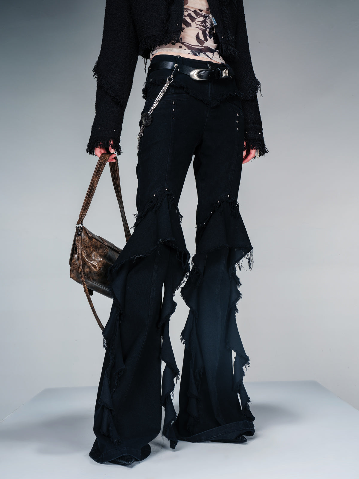 NN NORTH NODE Flared Denim Pants With Asymmetrical Hem