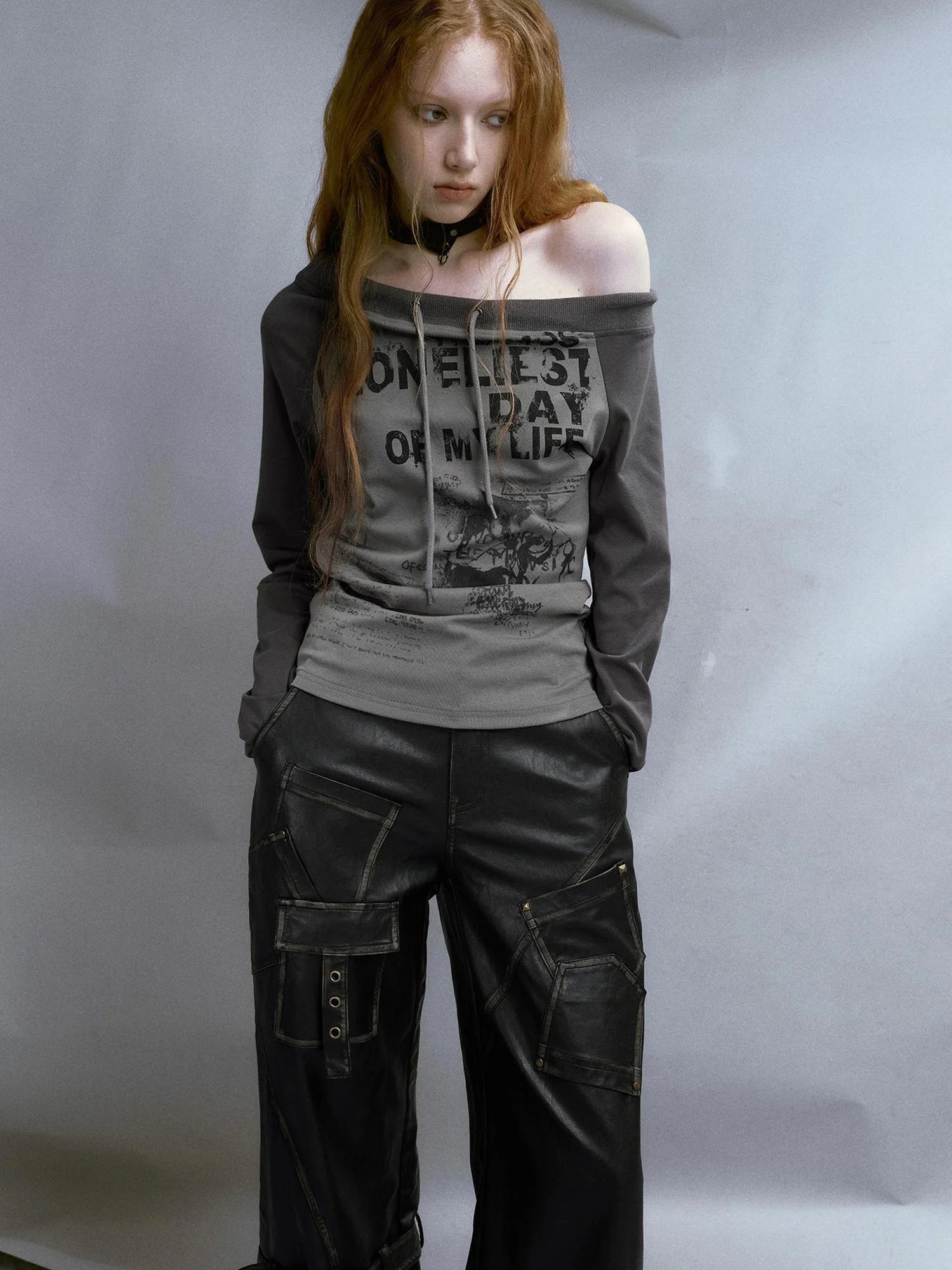 Run From Bad Love Asymmetrical Shoulder Graphic Knit Top