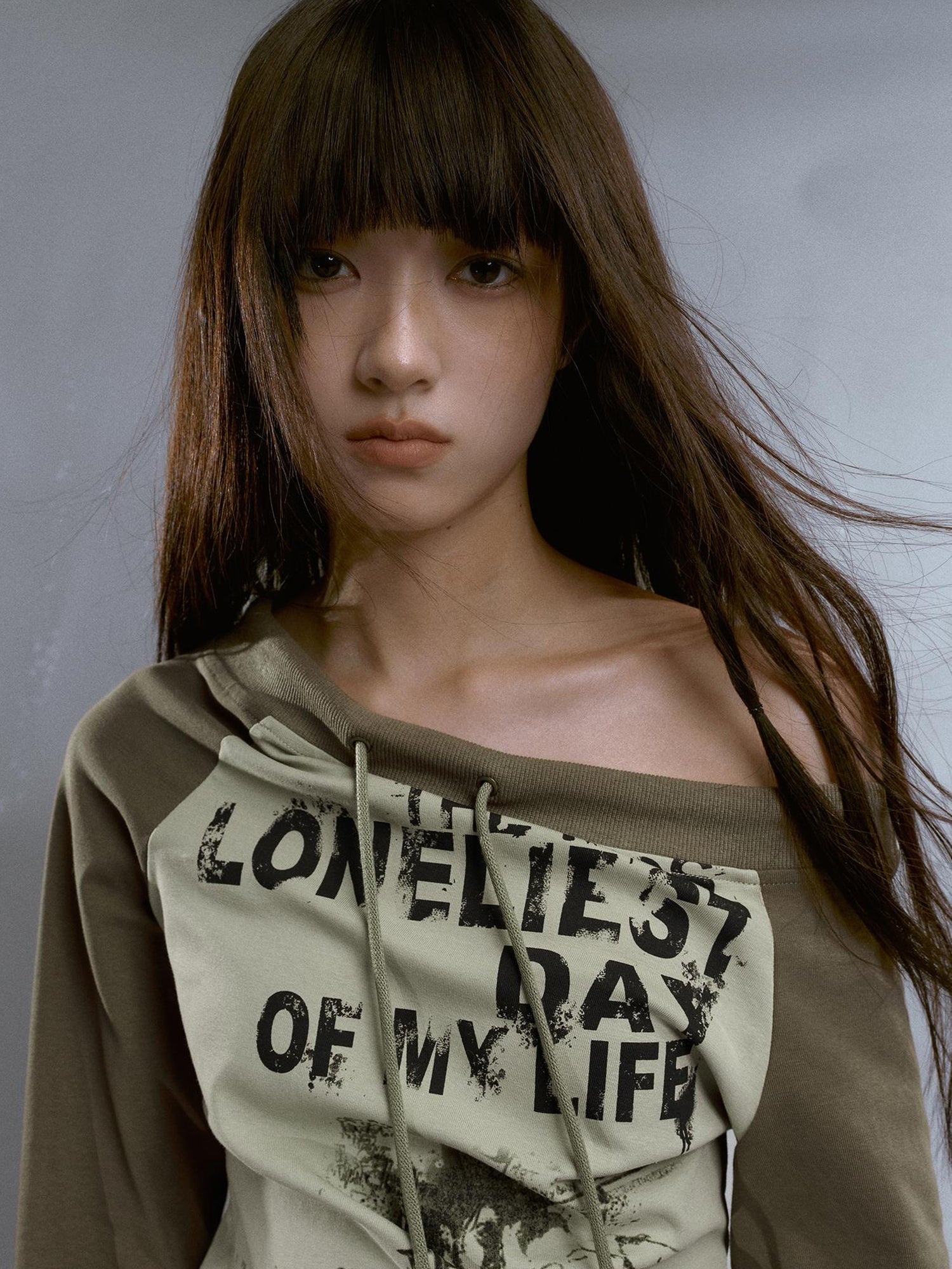 Cest Nous Run From Bad Love Asymmetrical Shoulder Graphic Knit Top