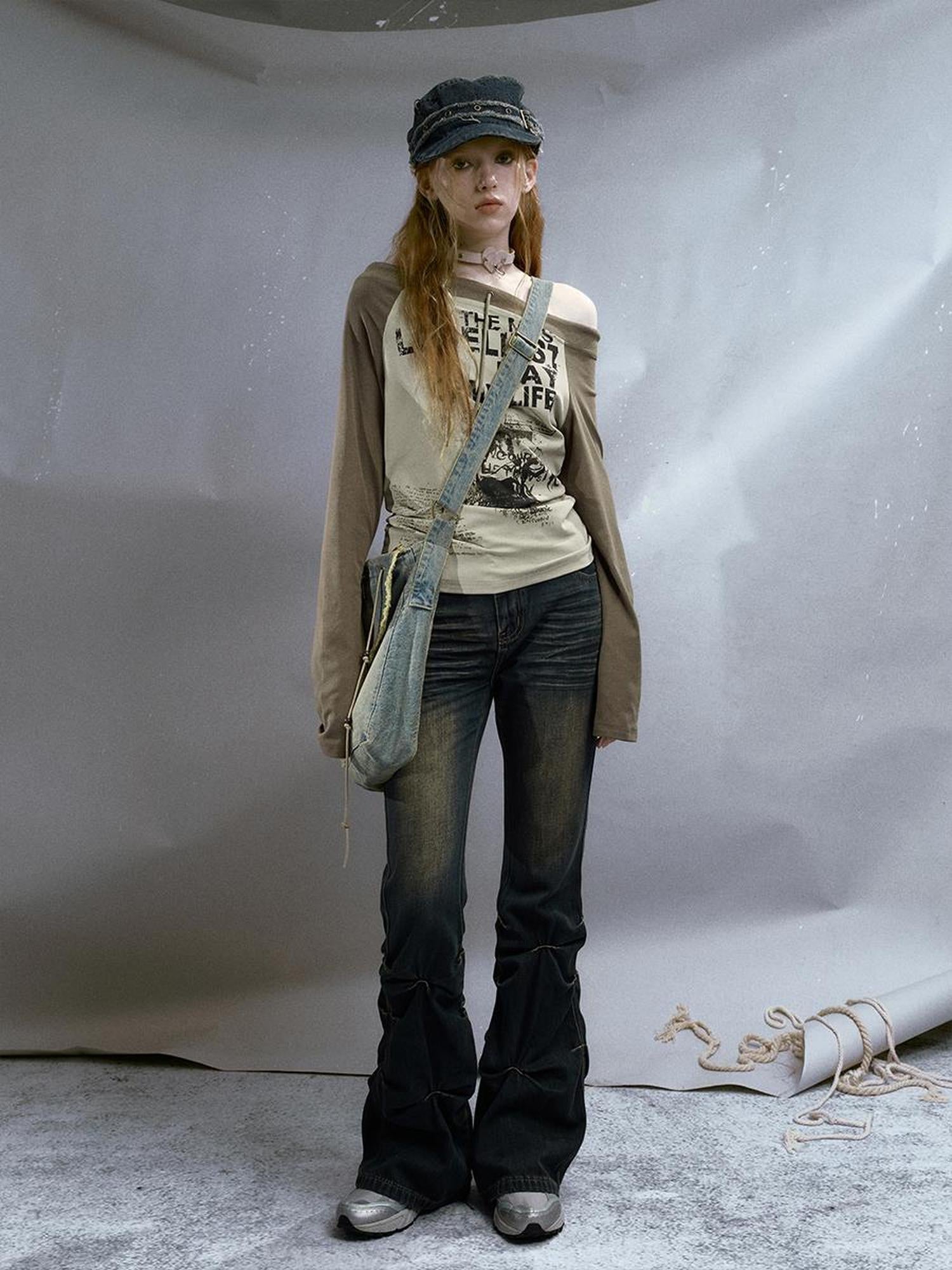 Cest Nous Run From Bad Love Asymmetrical Shoulder Graphic Knit Top