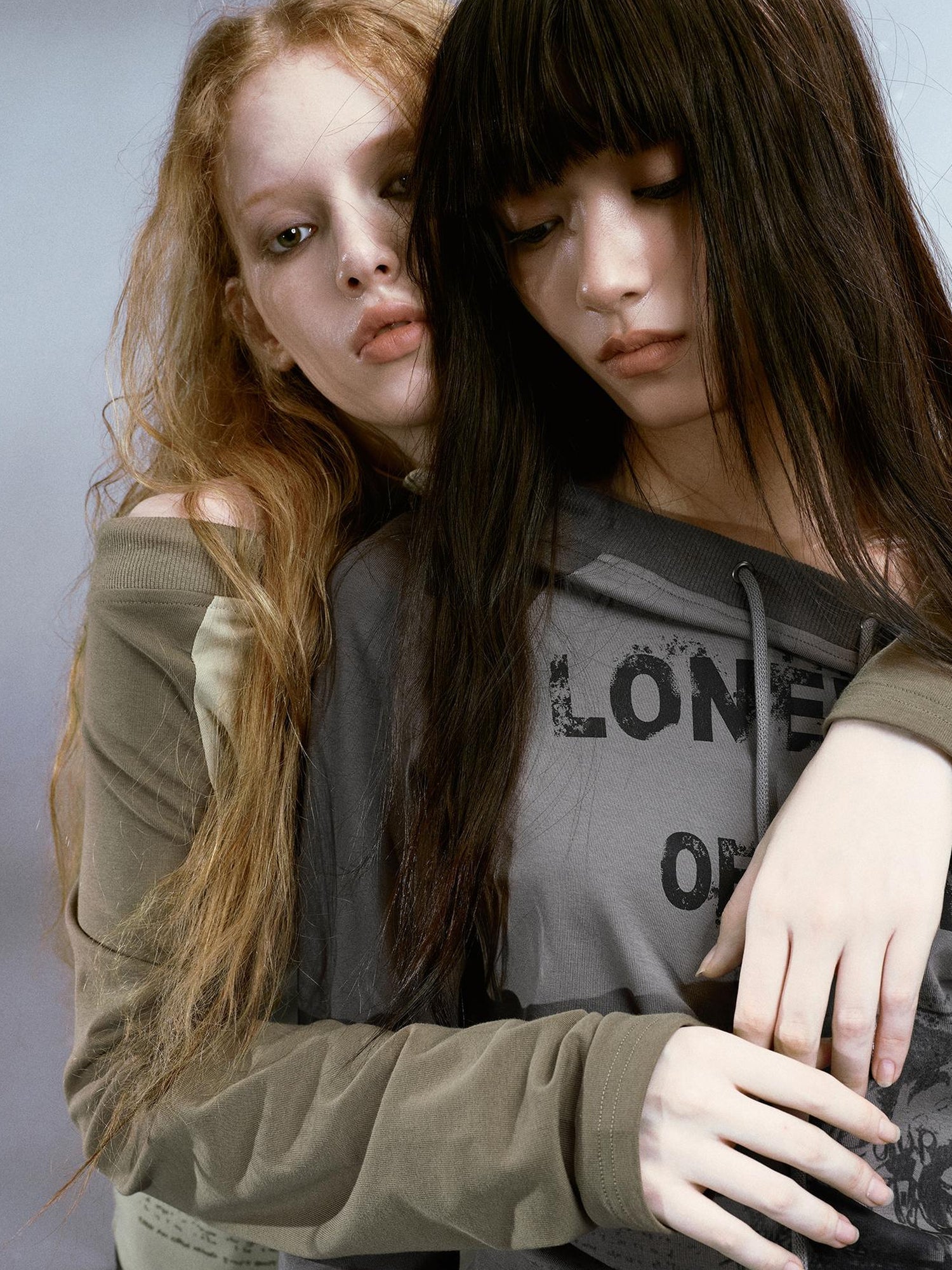 Cest Nous Run From Bad Love Asymmetrical Shoulder Graphic Knit Top