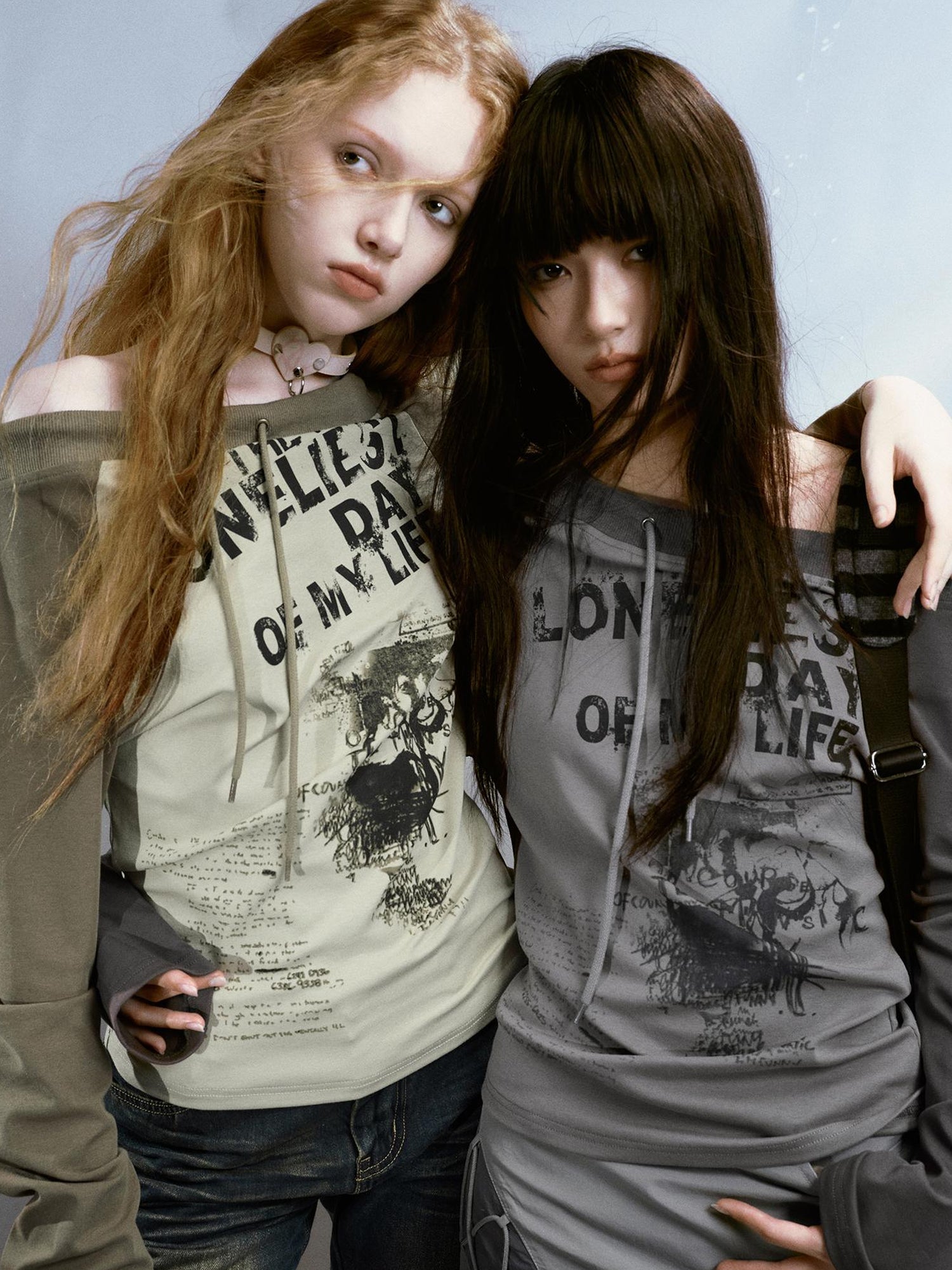 Cest Nous Run From Bad Love Asymmetrical Shoulder Graphic Knit Top