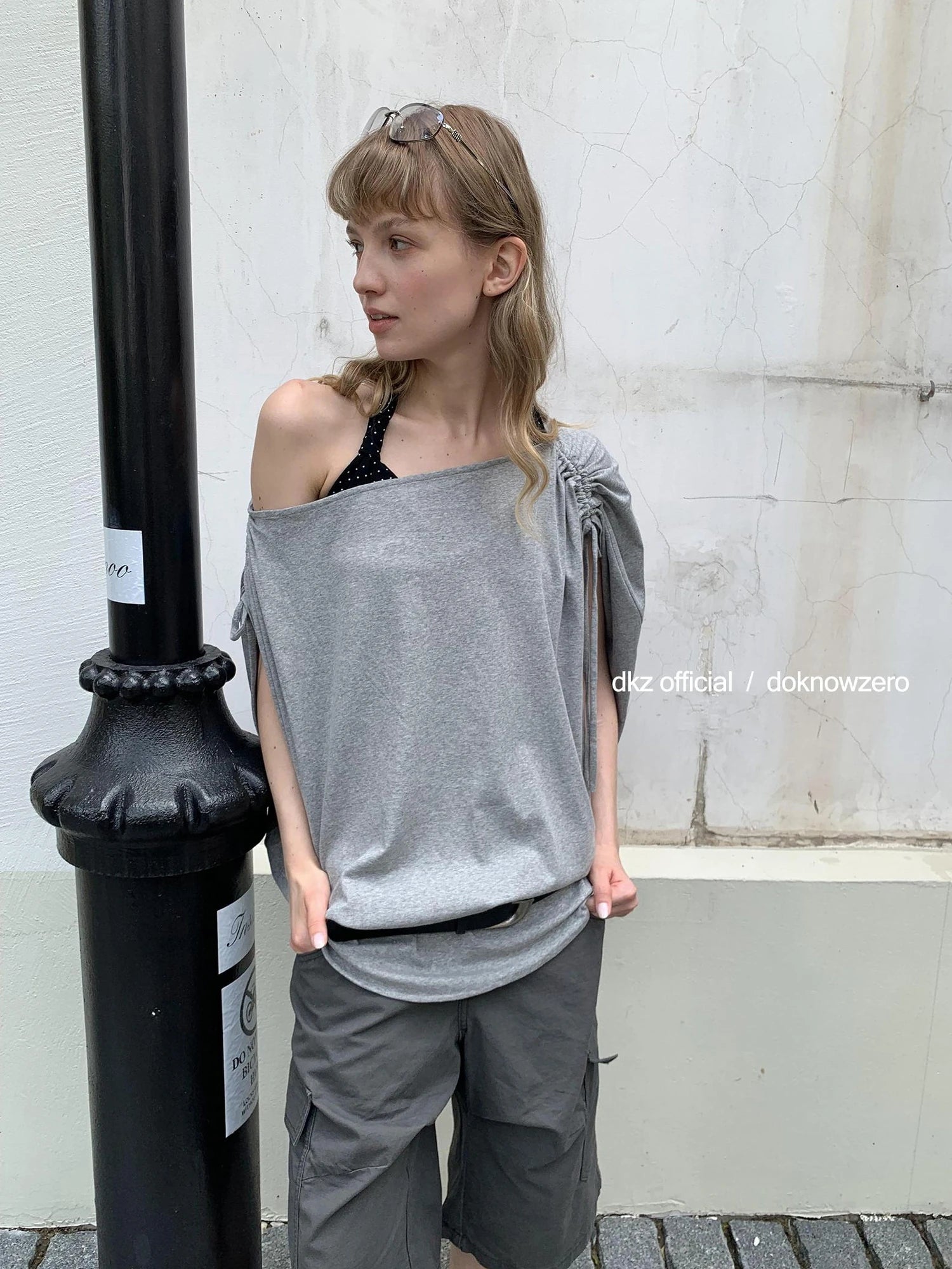 DKZ OFFICIAL Gray Batwing Sleeve T-shirt With Drawstring And Off-Shoulder Design