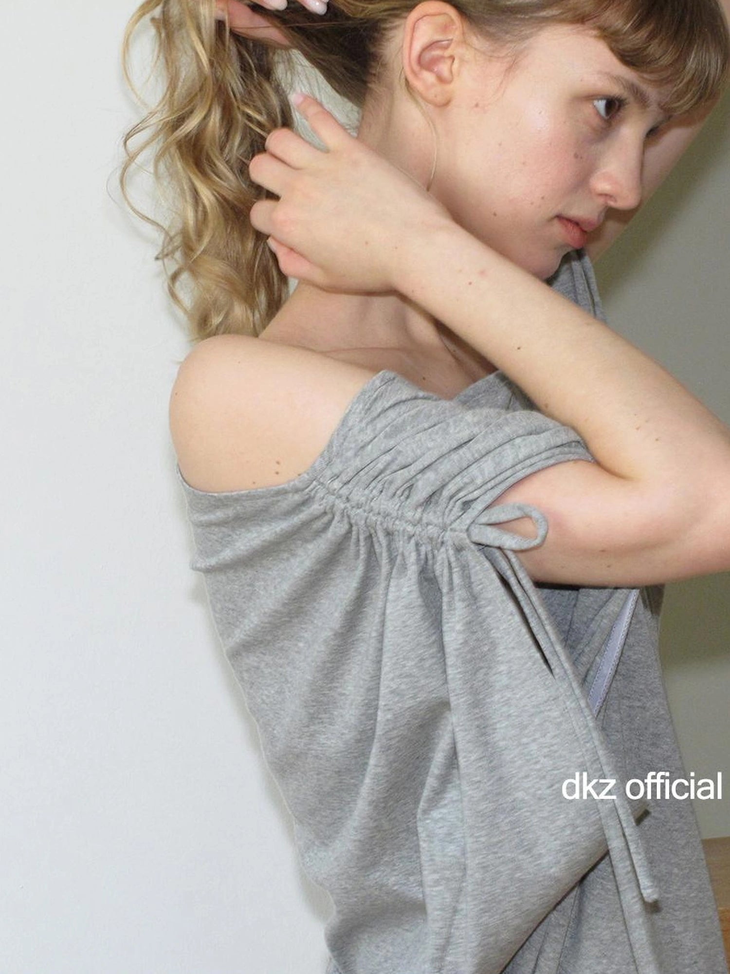DKZ OFFICIAL Gray Batwing Sleeve T-shirt With Drawstring And Off-Shoulder Design