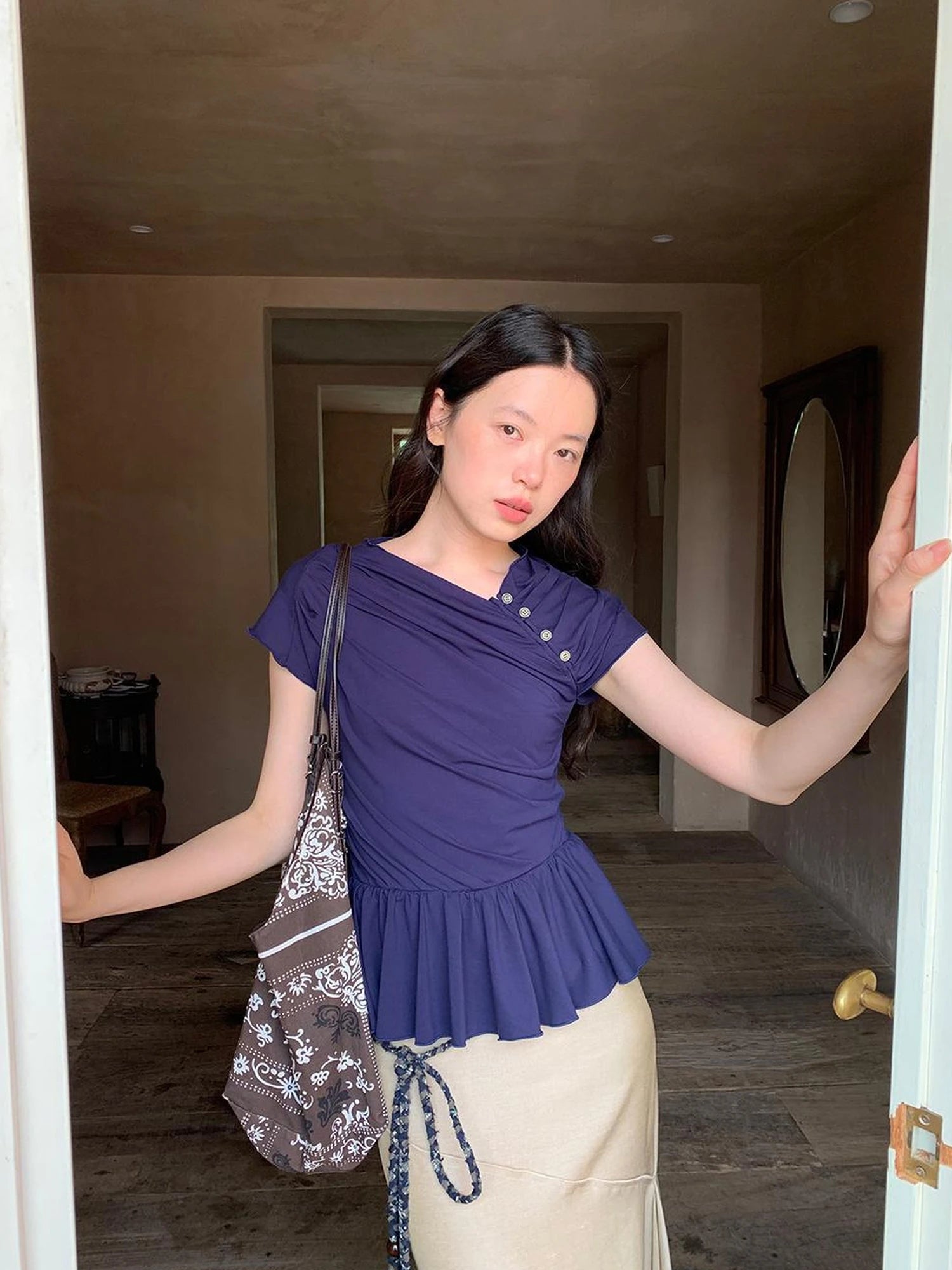 Asymmetrical Placket Tuck Detail Tee With Flounced Hem