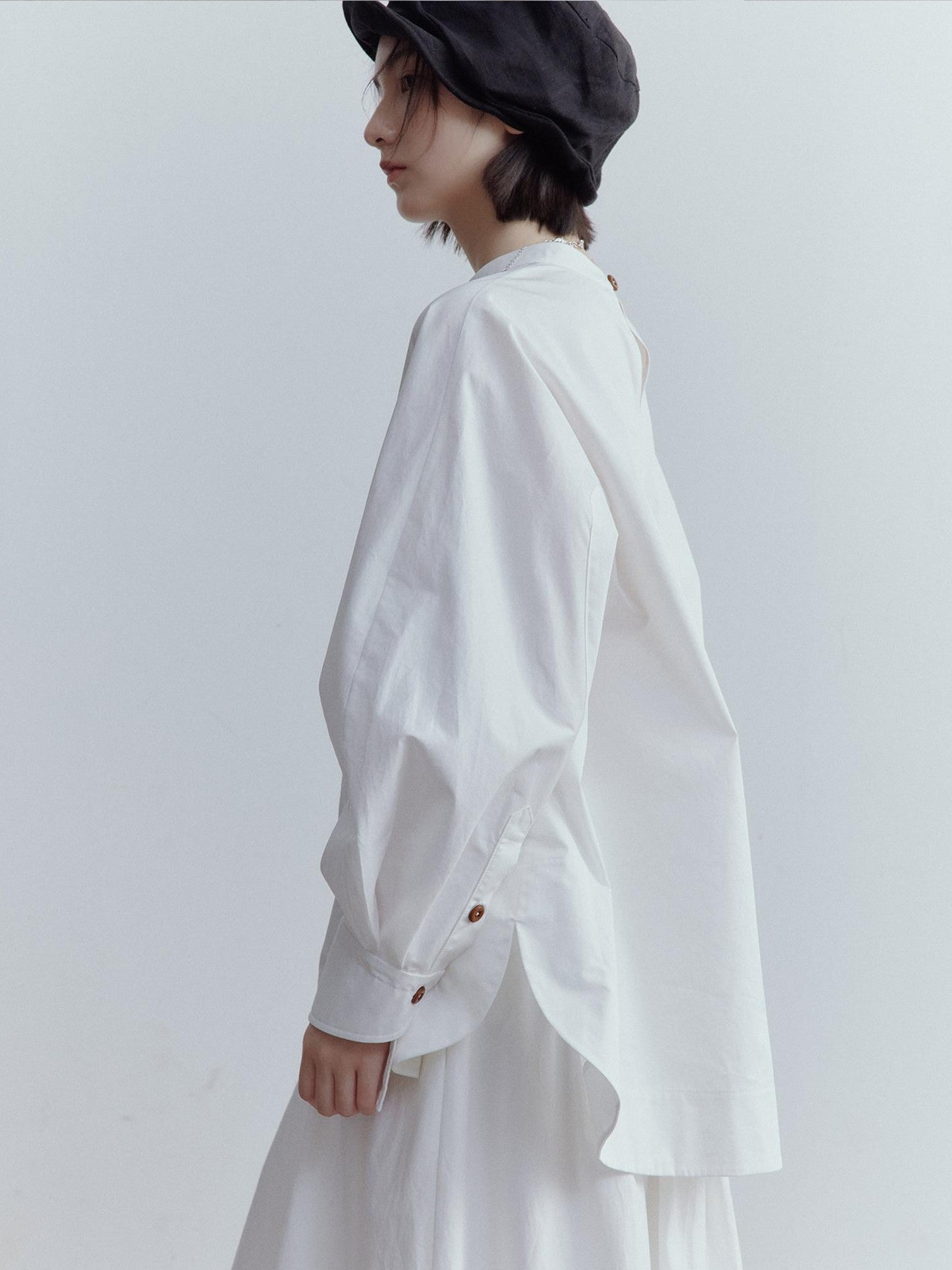 FUSSED Mist White Oversized Asymmetric Sleeve Cutout Splice Women&