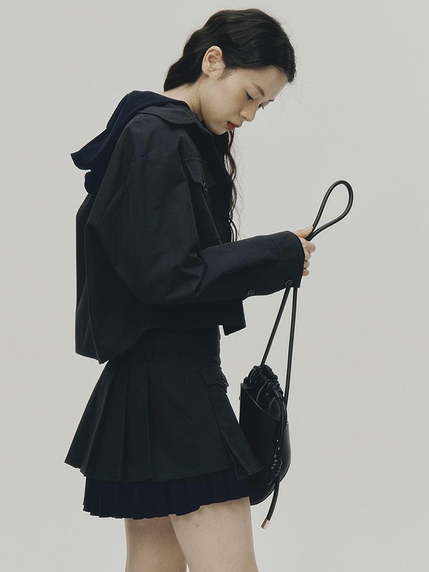 FUSSED Structured Pleated Mini Skirt With Asymmetric Pocket In Dusk Blue