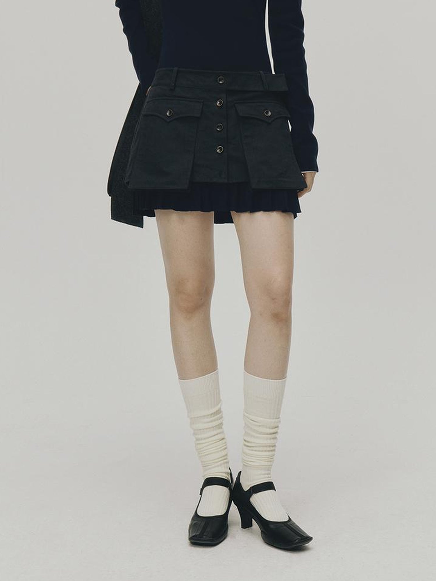 FUSSED Structured Pleated Mini Skirt With Asymmetric Pocket In Dusk Blue