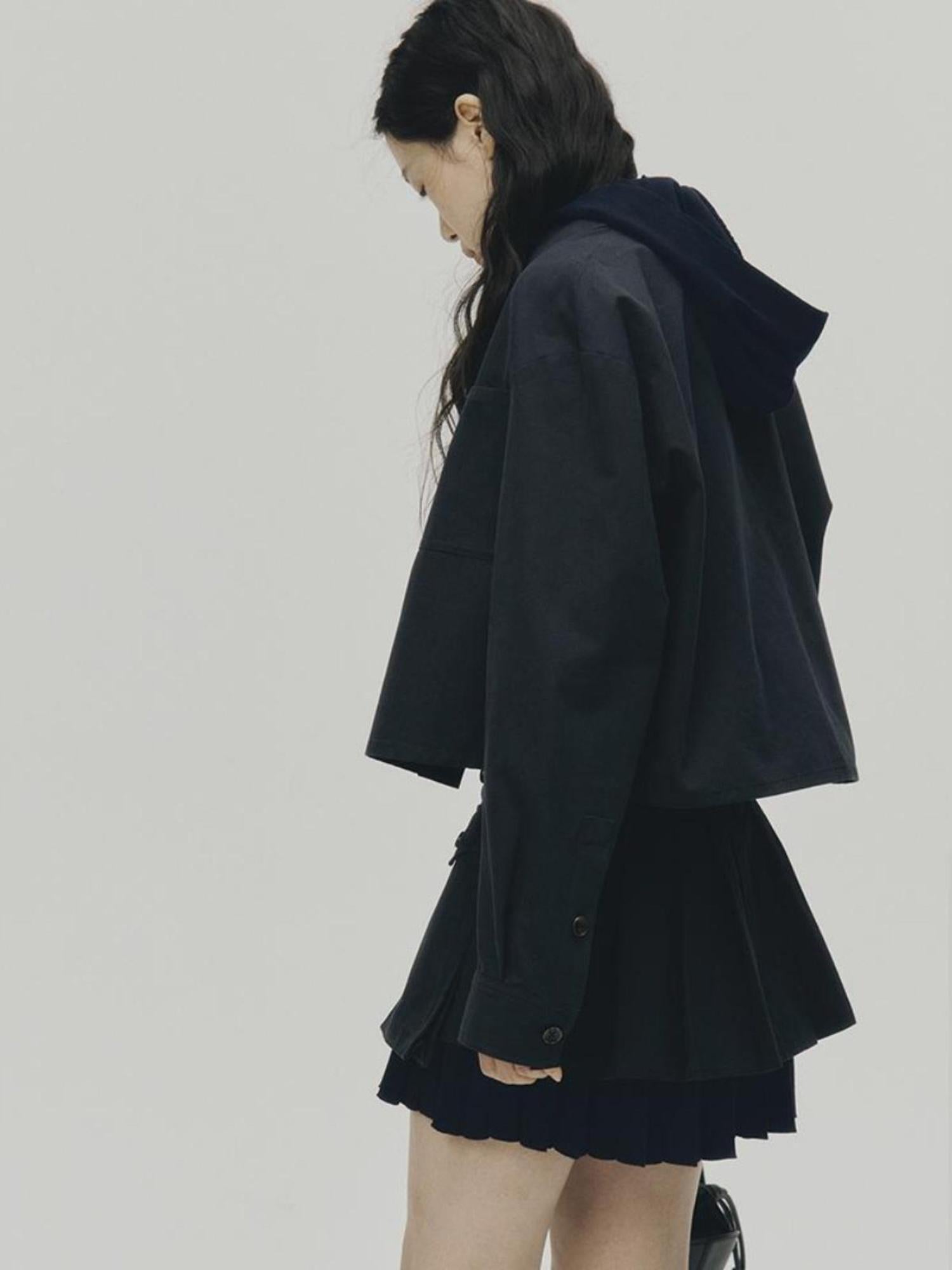 FUSSED Structured Pleated Mini Skirt With Asymmetric Pocket In Dusk Blue