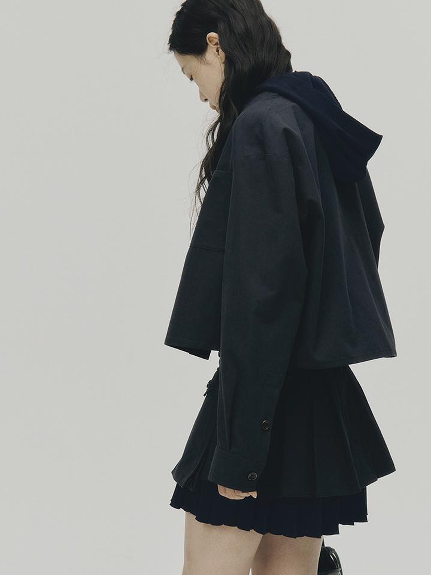 FUSSED Structured Pleated Mini Skirt With Asymmetric Pocket In Dusk Blue