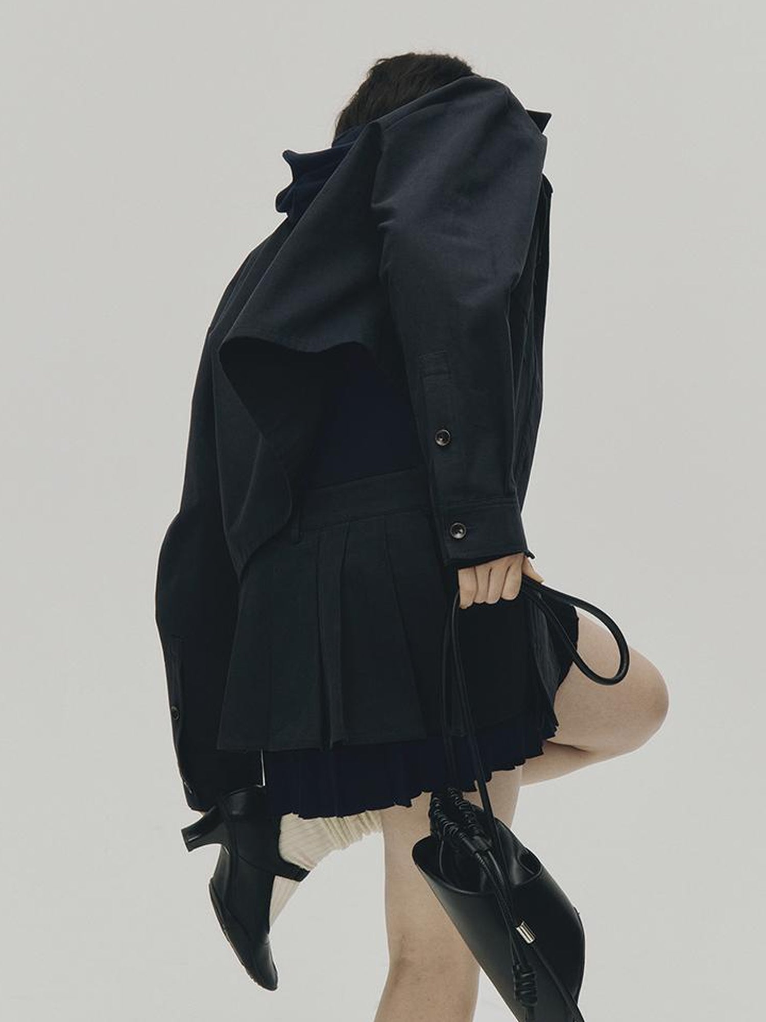 FUSSED Structured Pleated Mini Skirt With Asymmetric Pocket In Dusk Blue