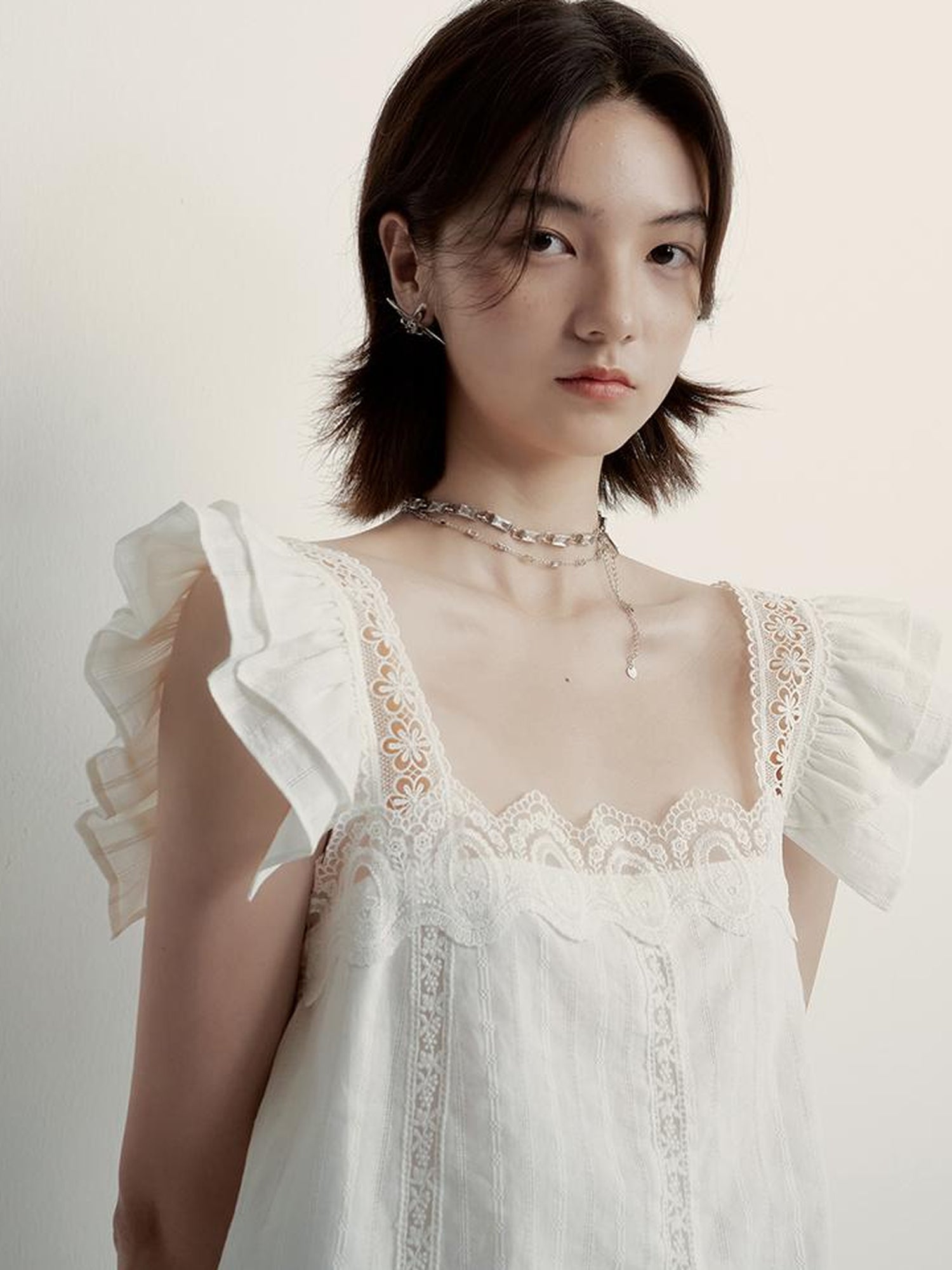 FUSSED White Lace Trimmed Peplum Top With Floral Embroidery