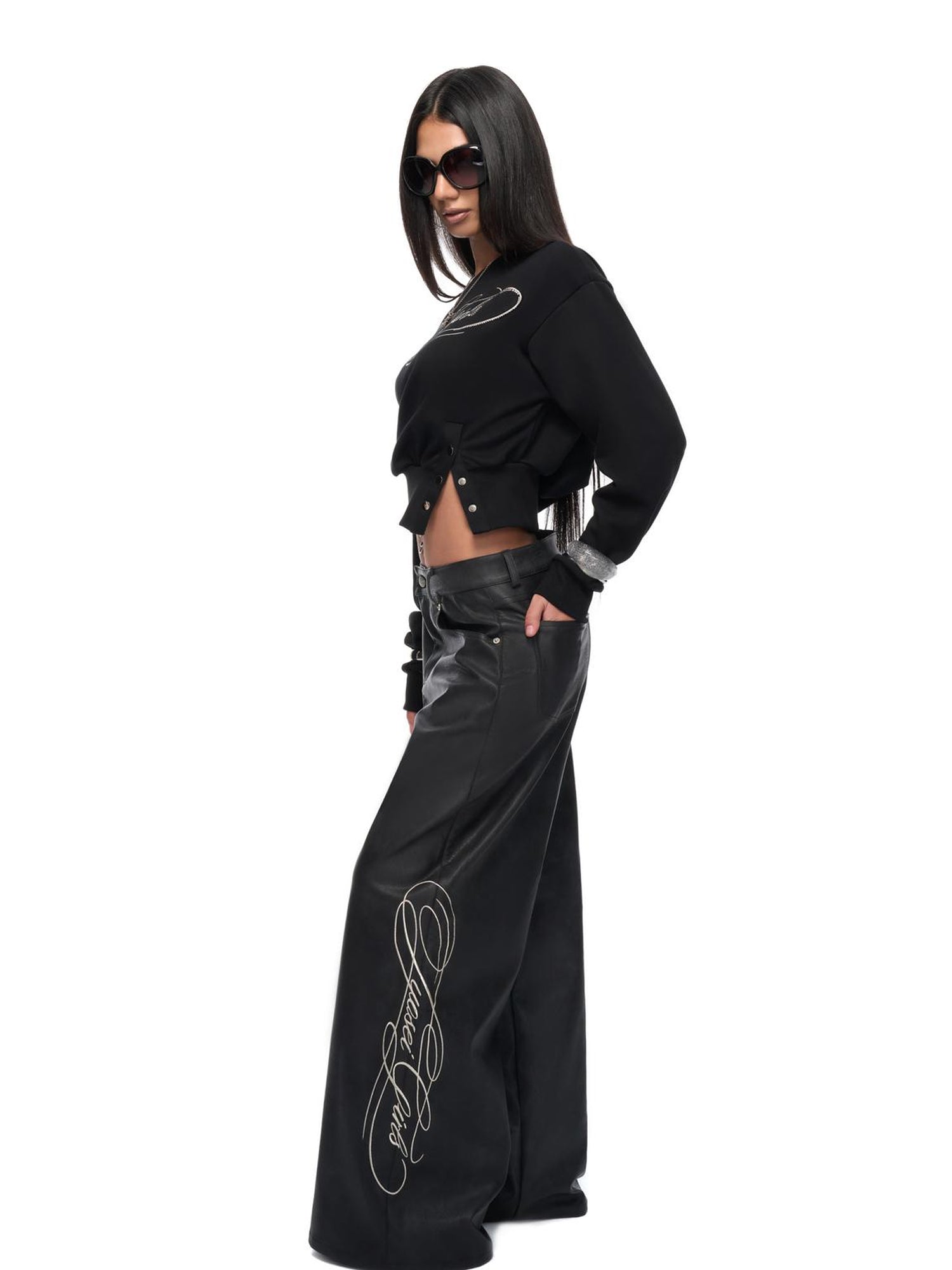 JYOSEI Off Shoulder Embroidered Crop Hoodie with Wide Leg Low Rise Leather Pants Set
