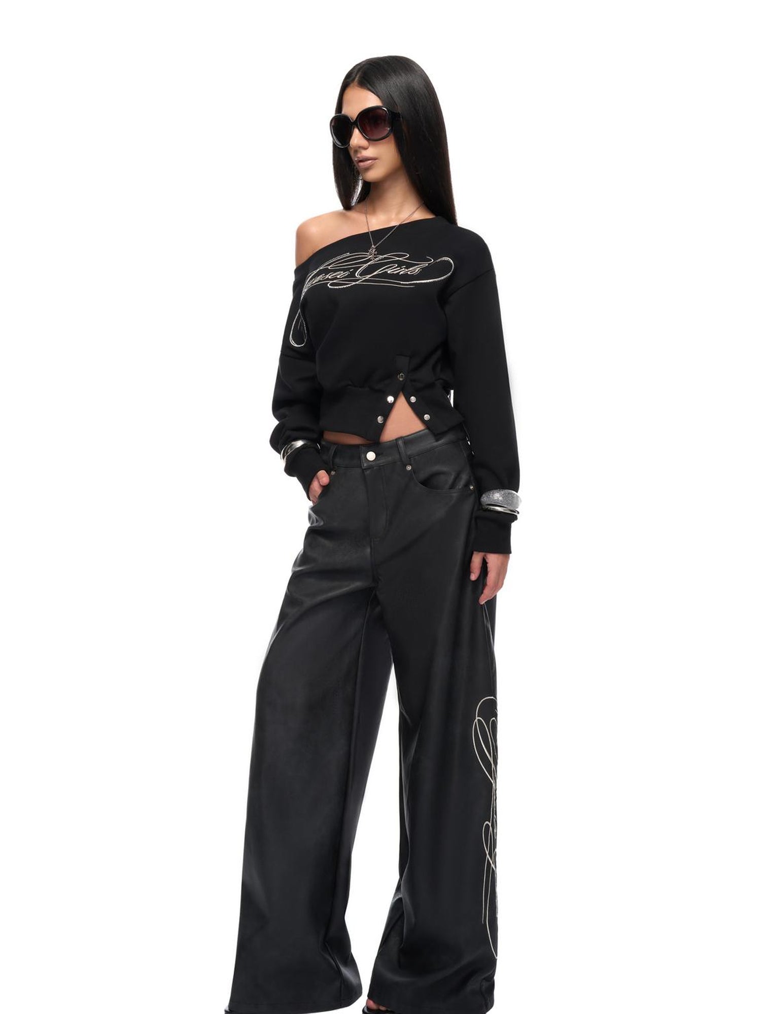 JYOSEI Off Shoulder Embroidered Crop Hoodie with Wide Leg Low Rise Leather Pants Set