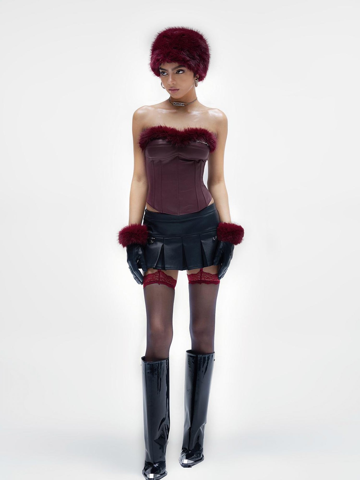 JYOSEI P U Mini Skirt with Eyelet Pin Detail Low Waist Stretch Leather