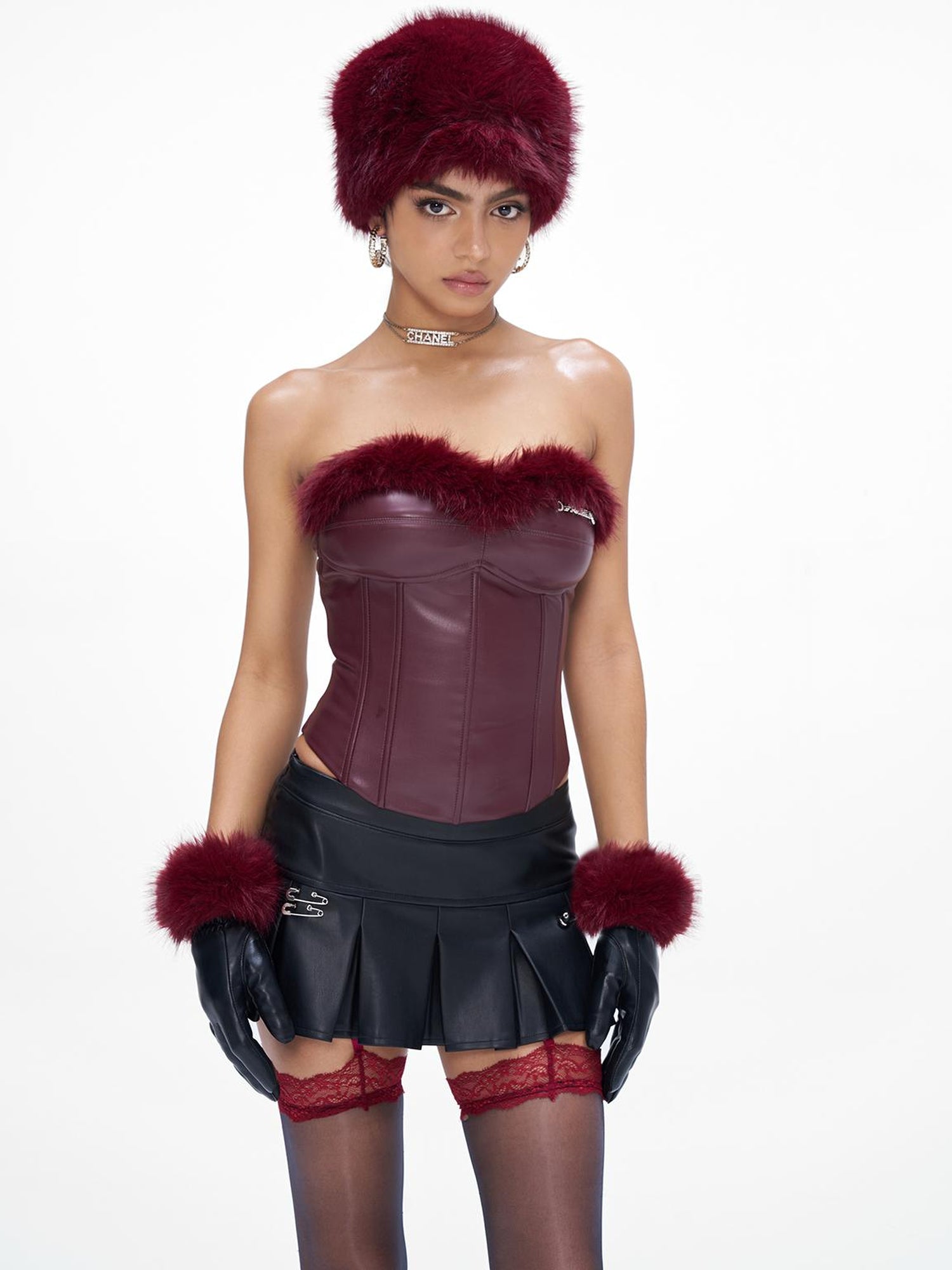 JYOSEI P U Mini Skirt with Eyelet Pin Detail Low Waist Stretch Leather