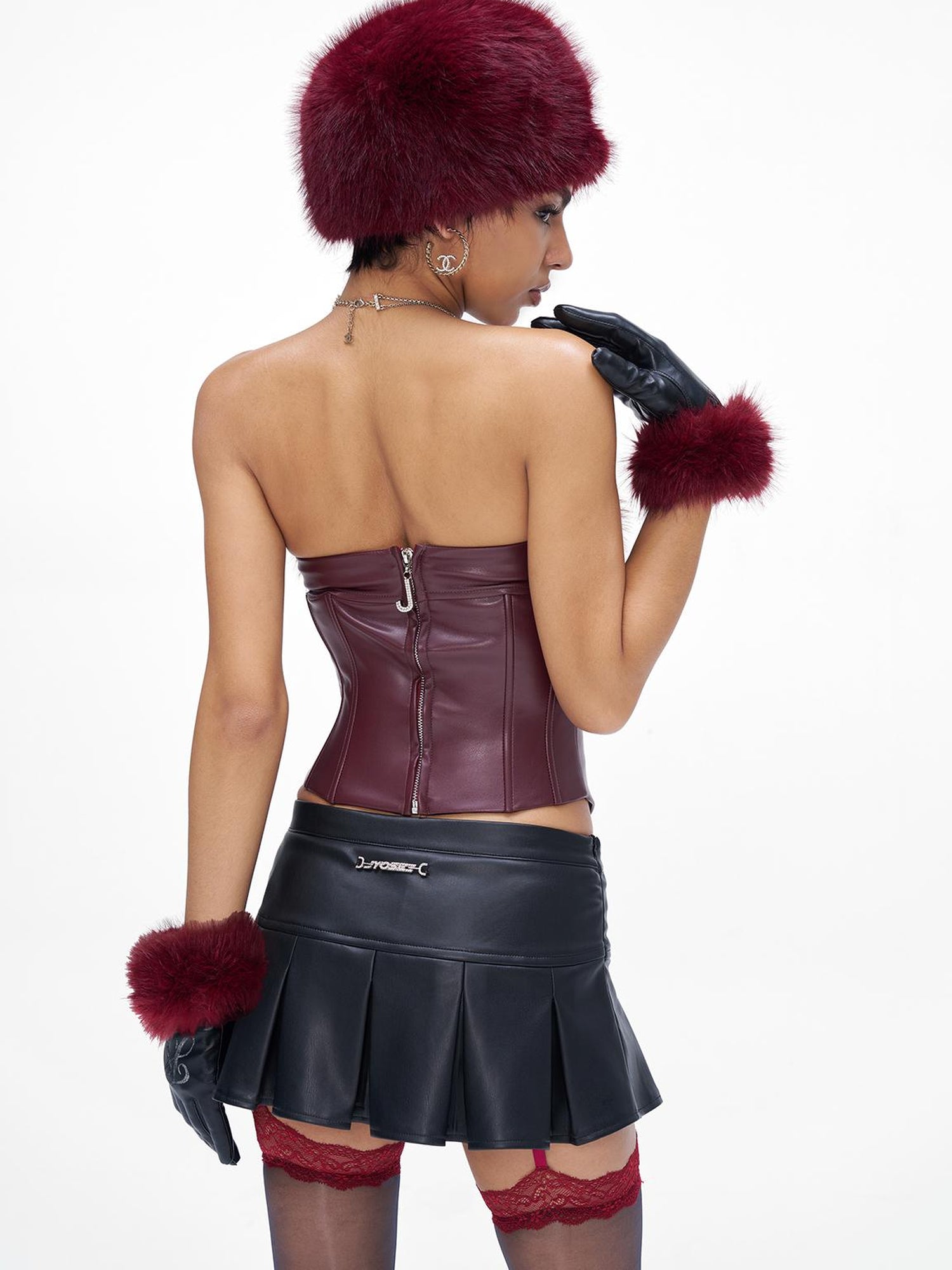 JYOSEI P U Mini Skirt with Eyelet Pin Detail Low Waist Stretch Leather