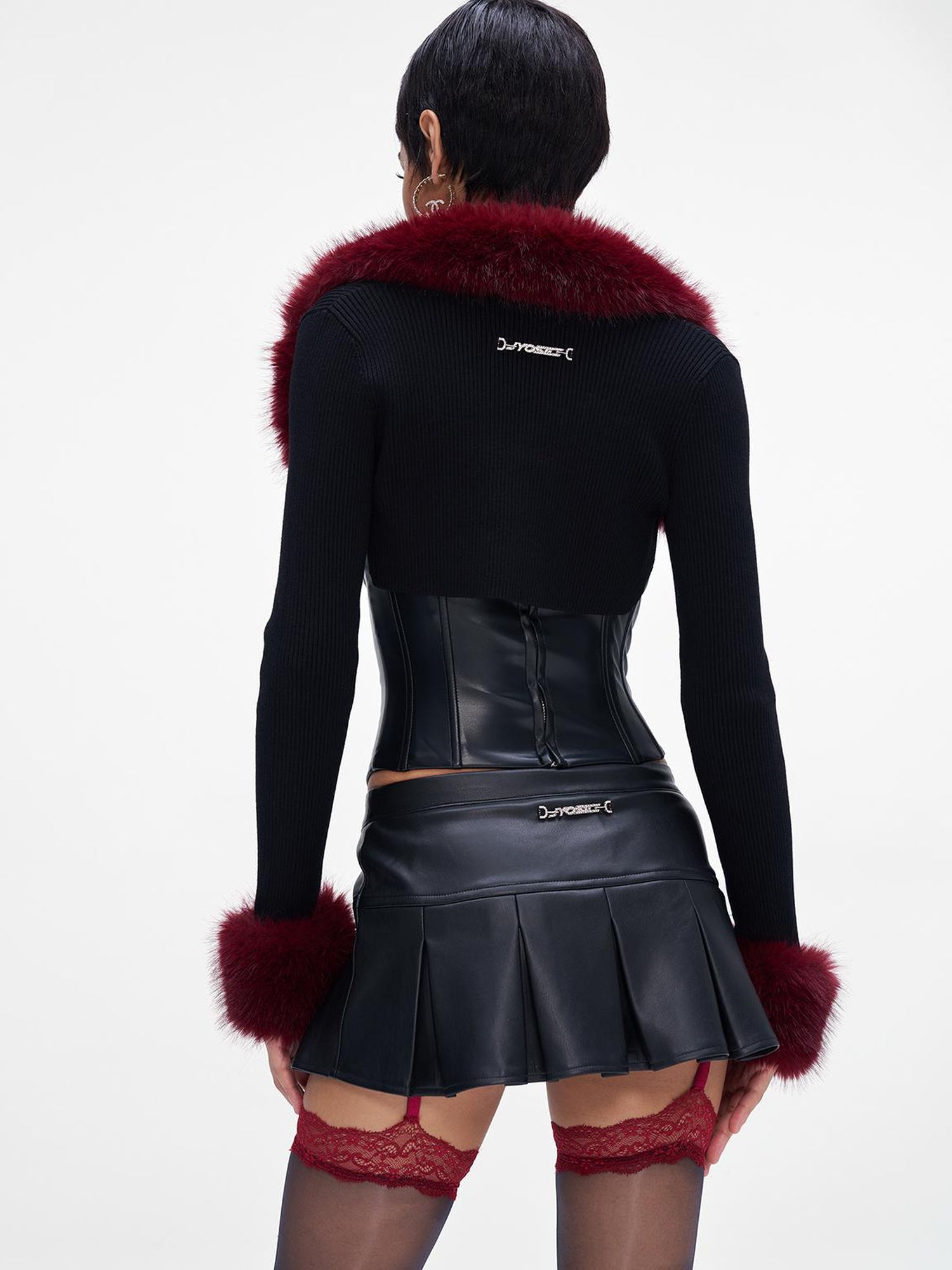 JYOSEI P U Mini Skirt with Eyelet Pin Detail Low Waist Stretch Leather