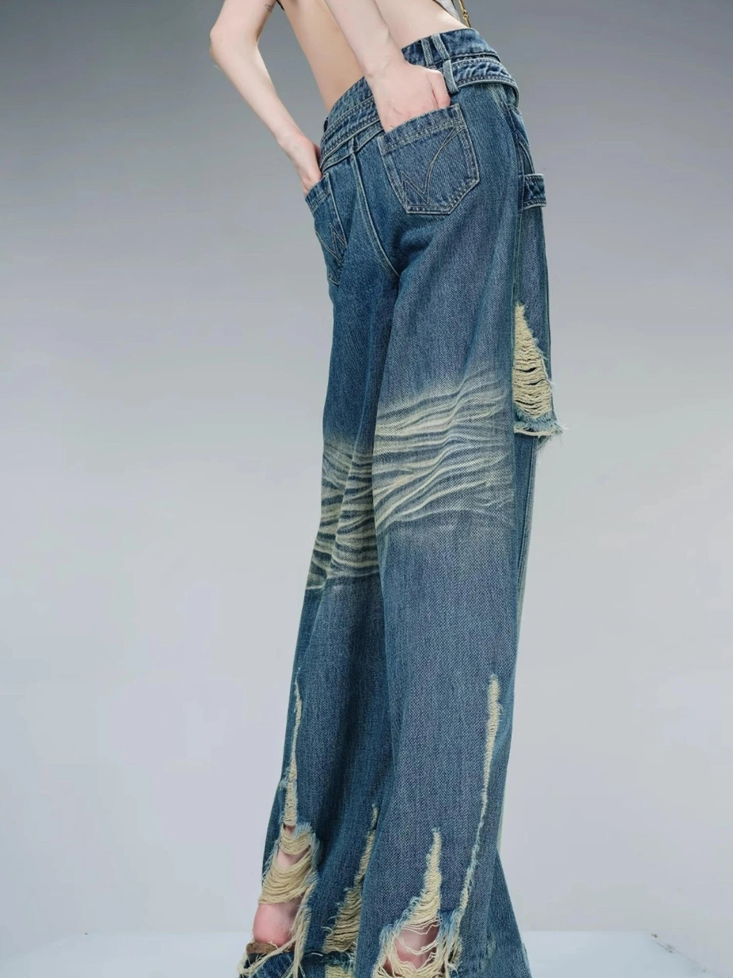 Distressed Pulled Denim Jeans With Ripped Details