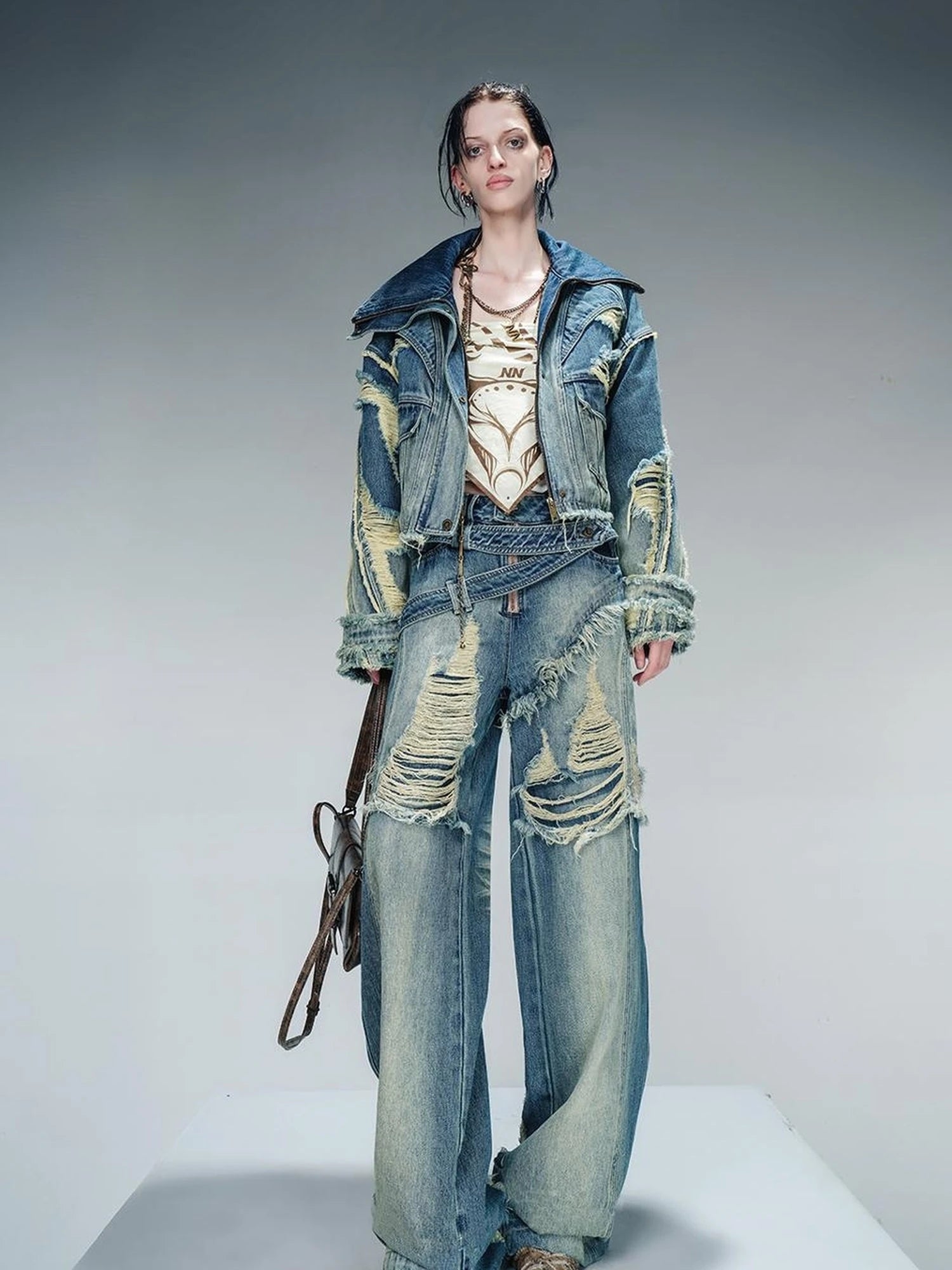 Distressed Pulled Denim Jeans With Ripped Details