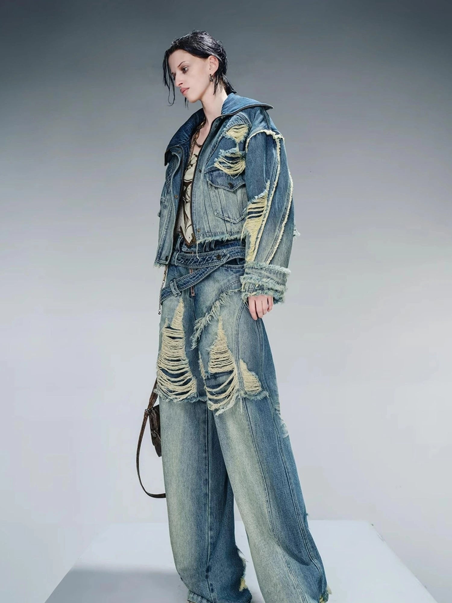 Distressed Pulled Denim Jeans With Ripped Details