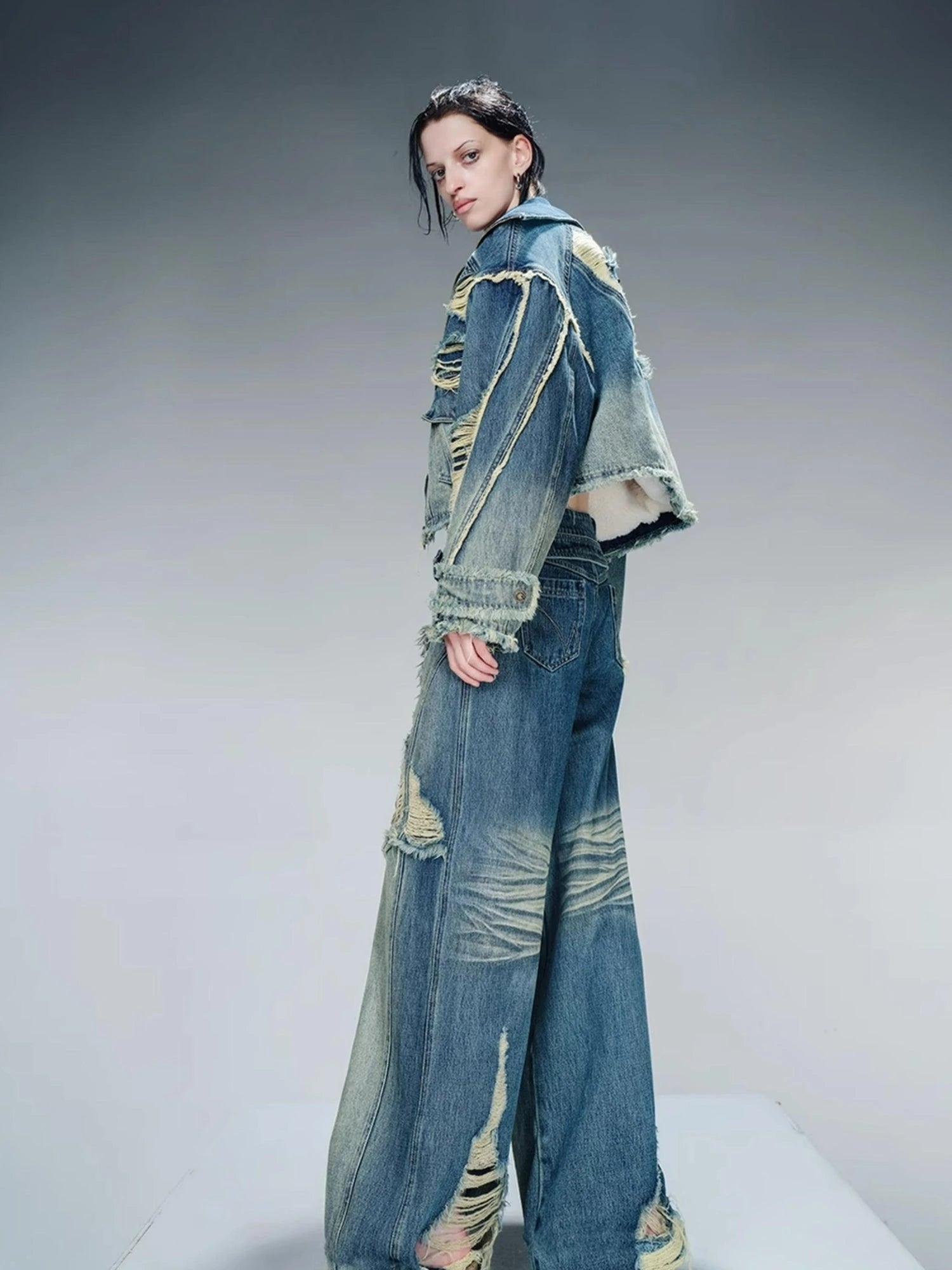 Distressed Pulled Denim Jeans With Ripped Details