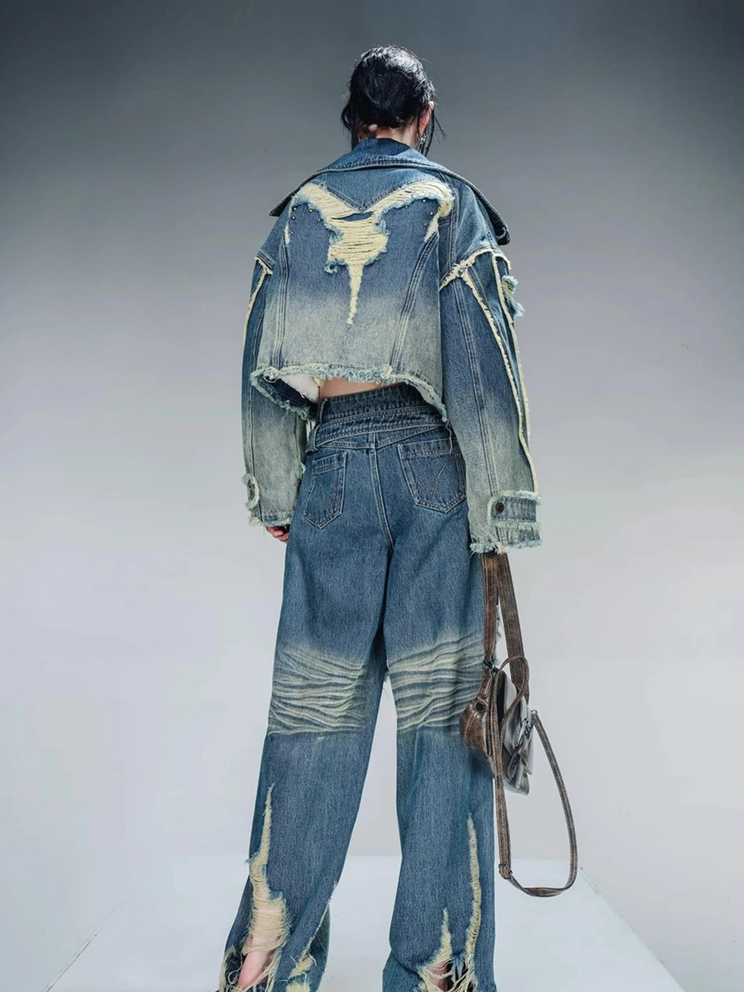 Distressed Pulled Denim Jeans With Ripped Details