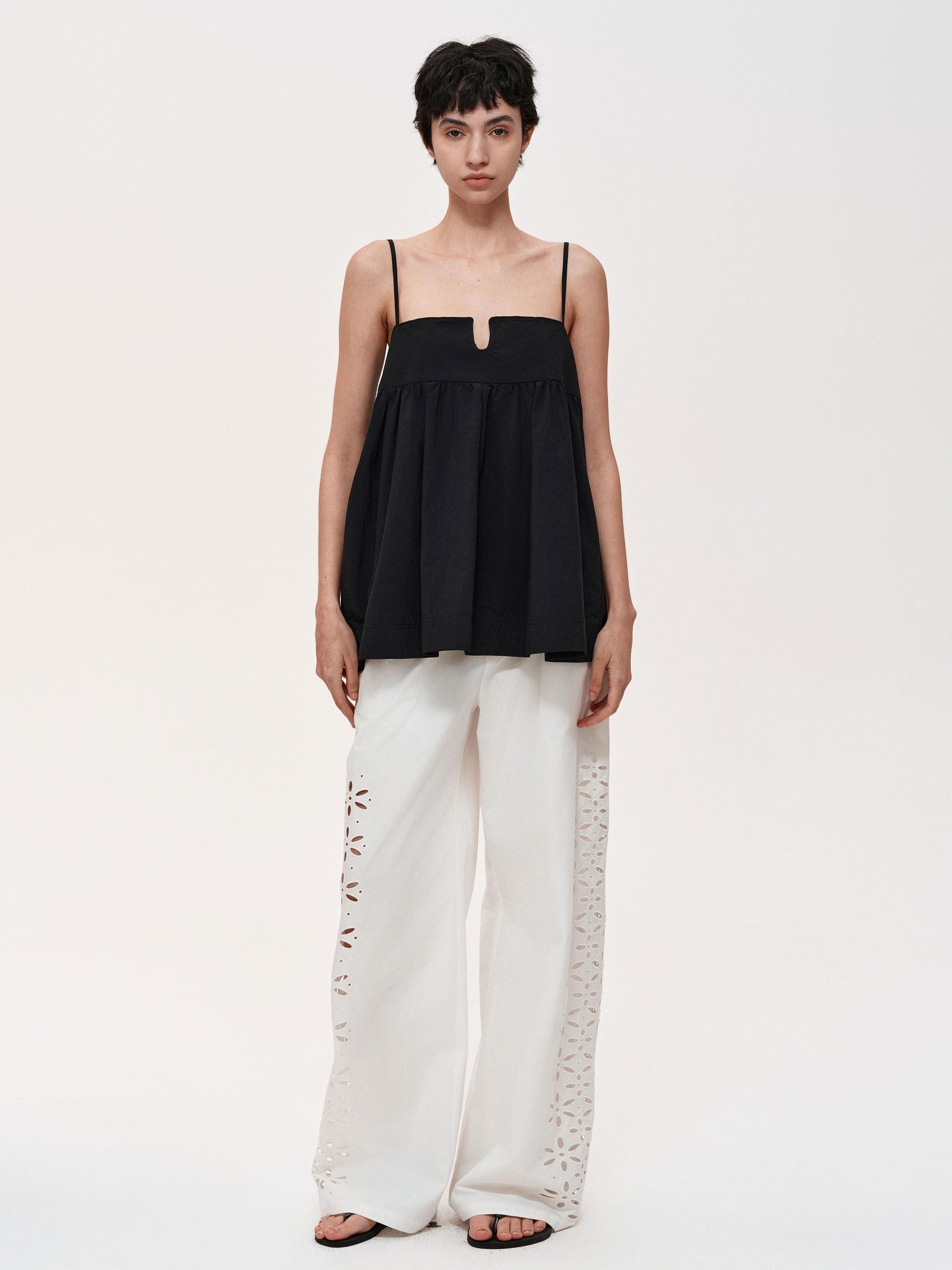 Northbutsouth Laser-Cut Hollow-Out Straight-Leg Pants In Black And White