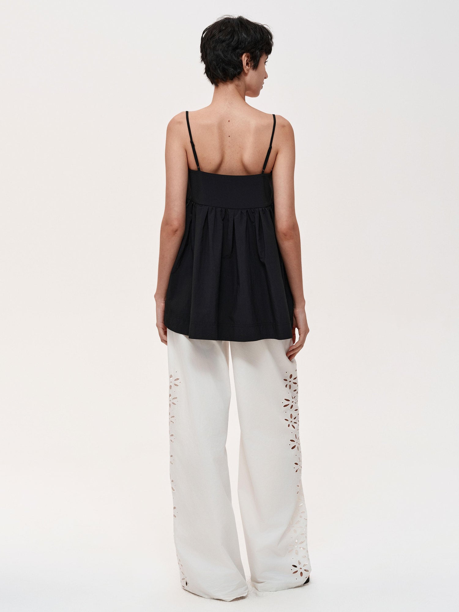 Northbutsouth Laser-Cut Hollow-Out Straight-Leg Pants In Black And White