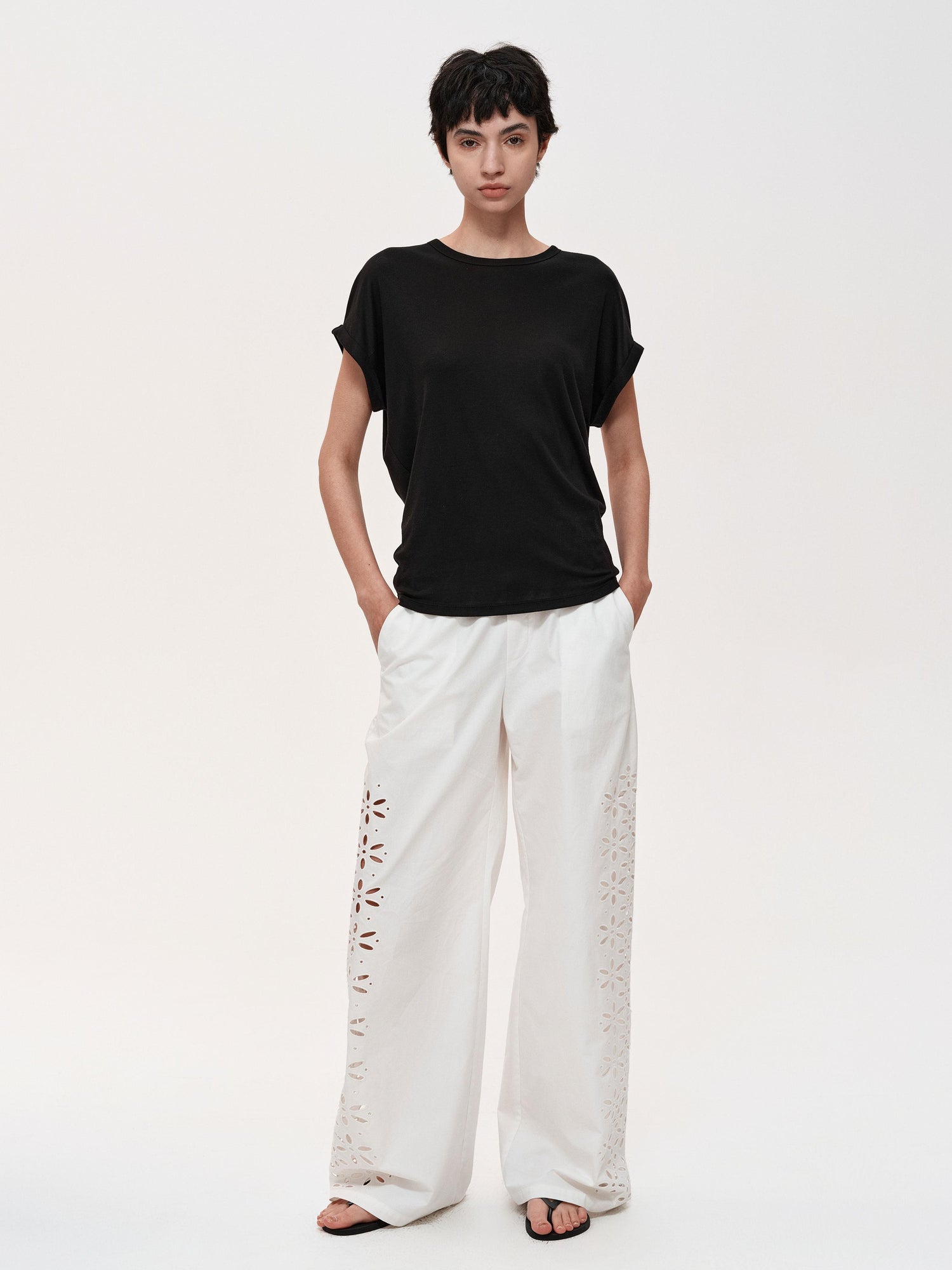 Northbutsouth Laser-Cut Hollow-Out Straight-Leg Pants In Black And White