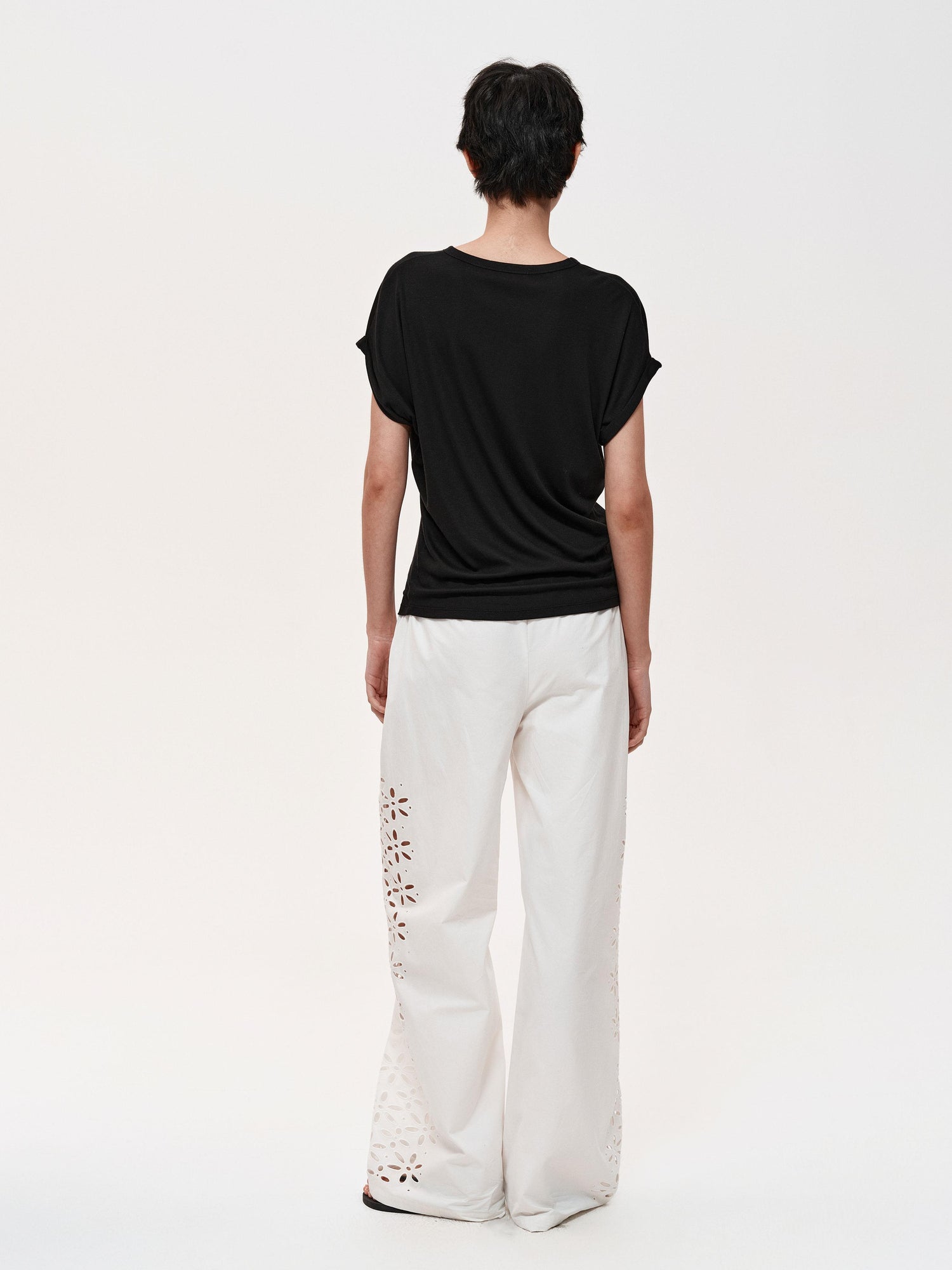 Northbutsouth Laser-Cut Hollow-Out Straight-Leg Pants In Black And White