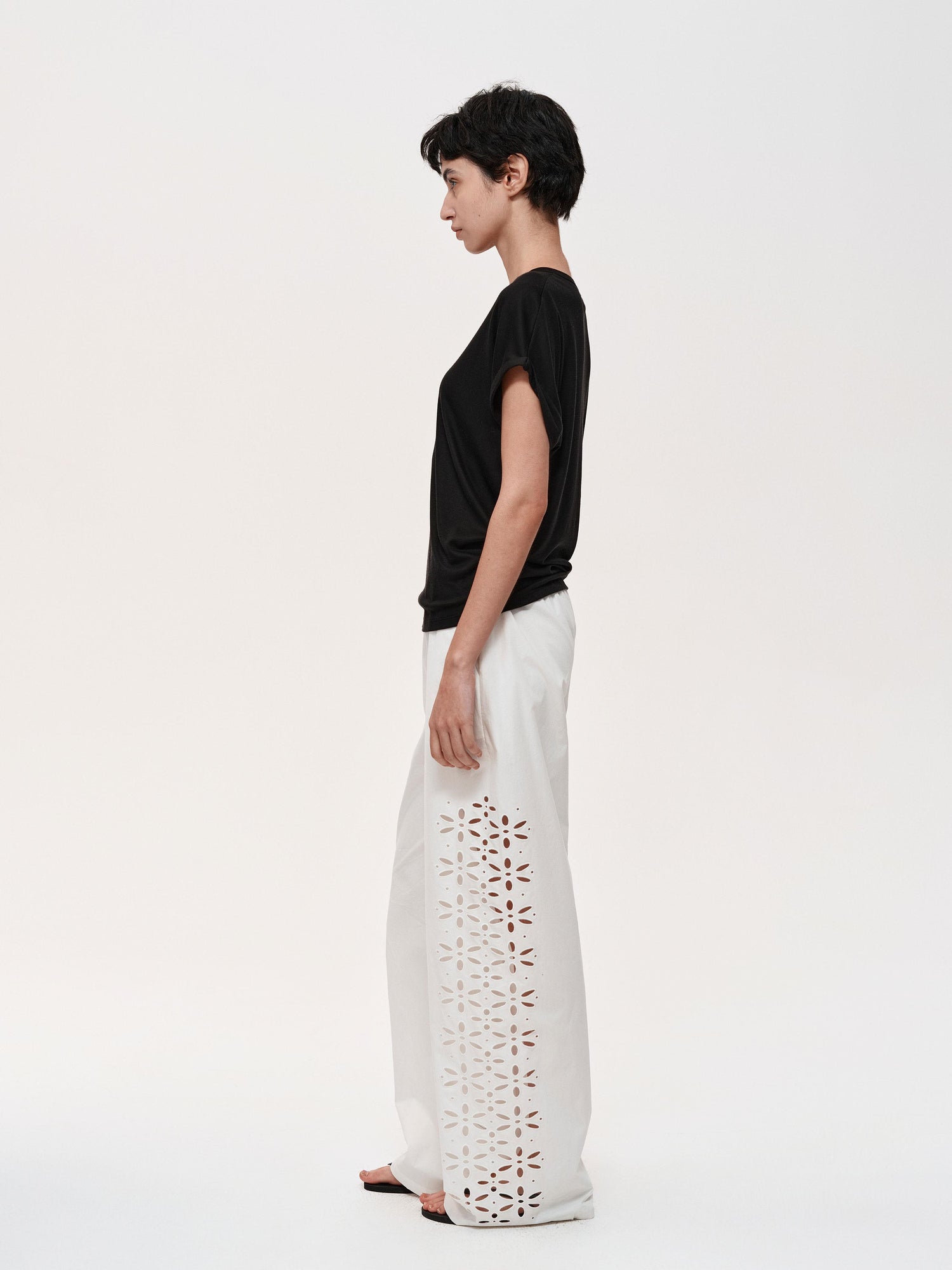 Northbutsouth Laser-Cut Hollow-Out Straight-Leg Pants In Black And White