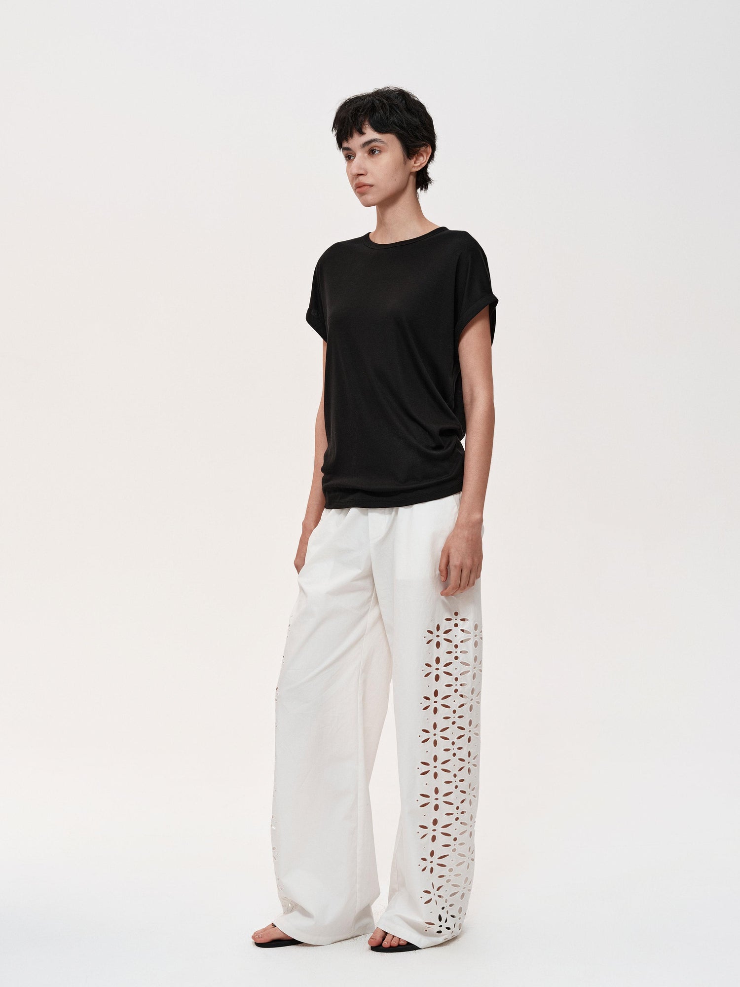 Northbutsouth Laser-Cut Hollow-Out Straight-Leg Pants In Black And White