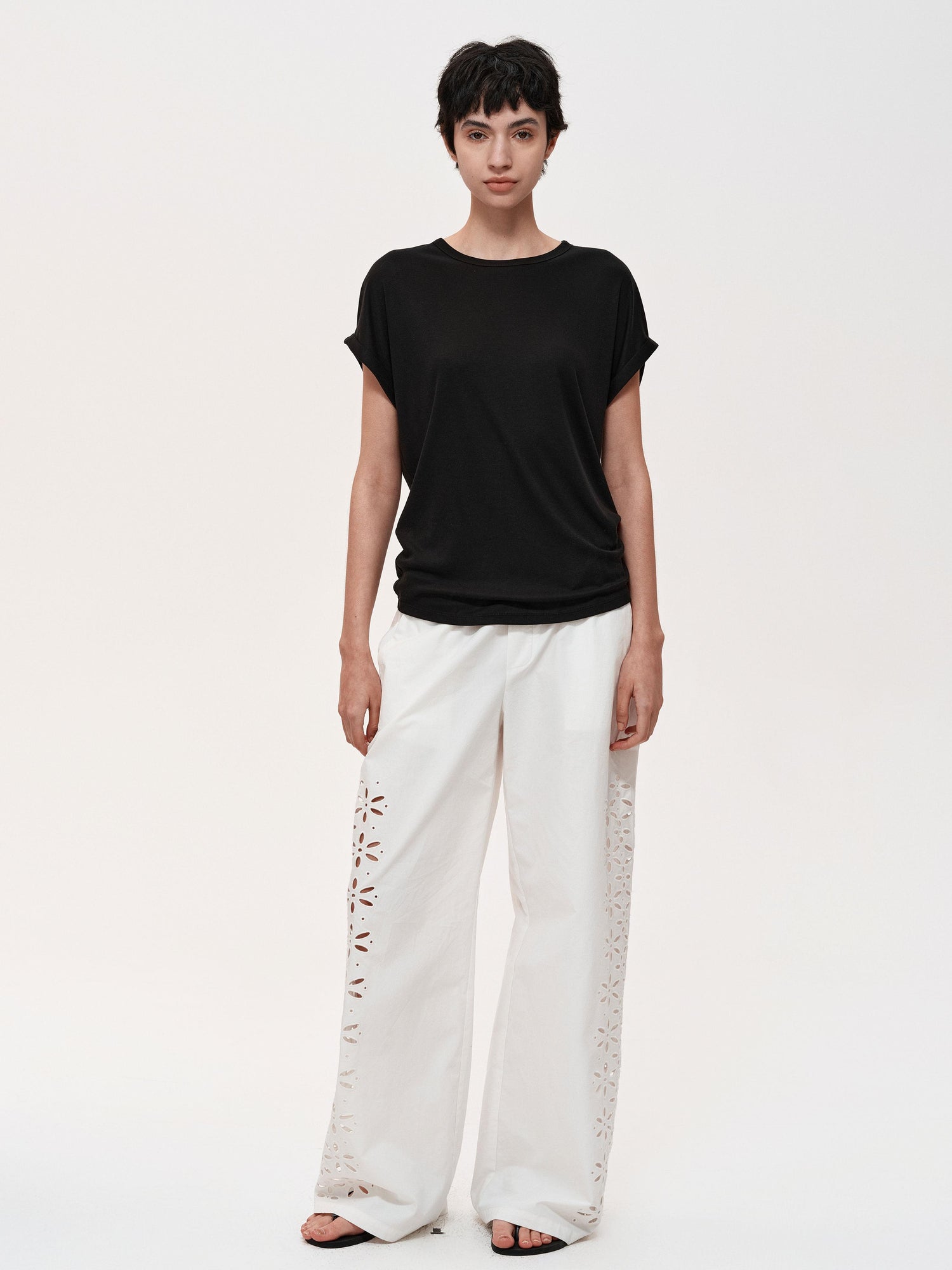 Northbutsouth Laser-Cut Hollow-Out Straight-Leg Pants In Black And White