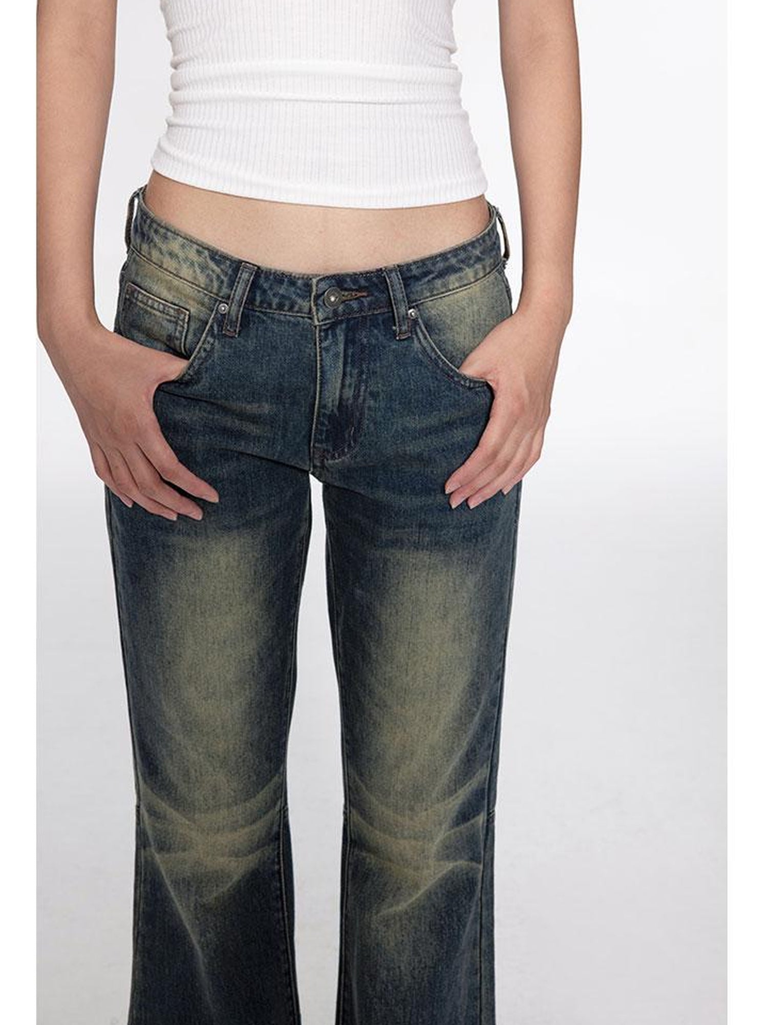 oinimi Low Rise Flared Jeans With Stacked Hem