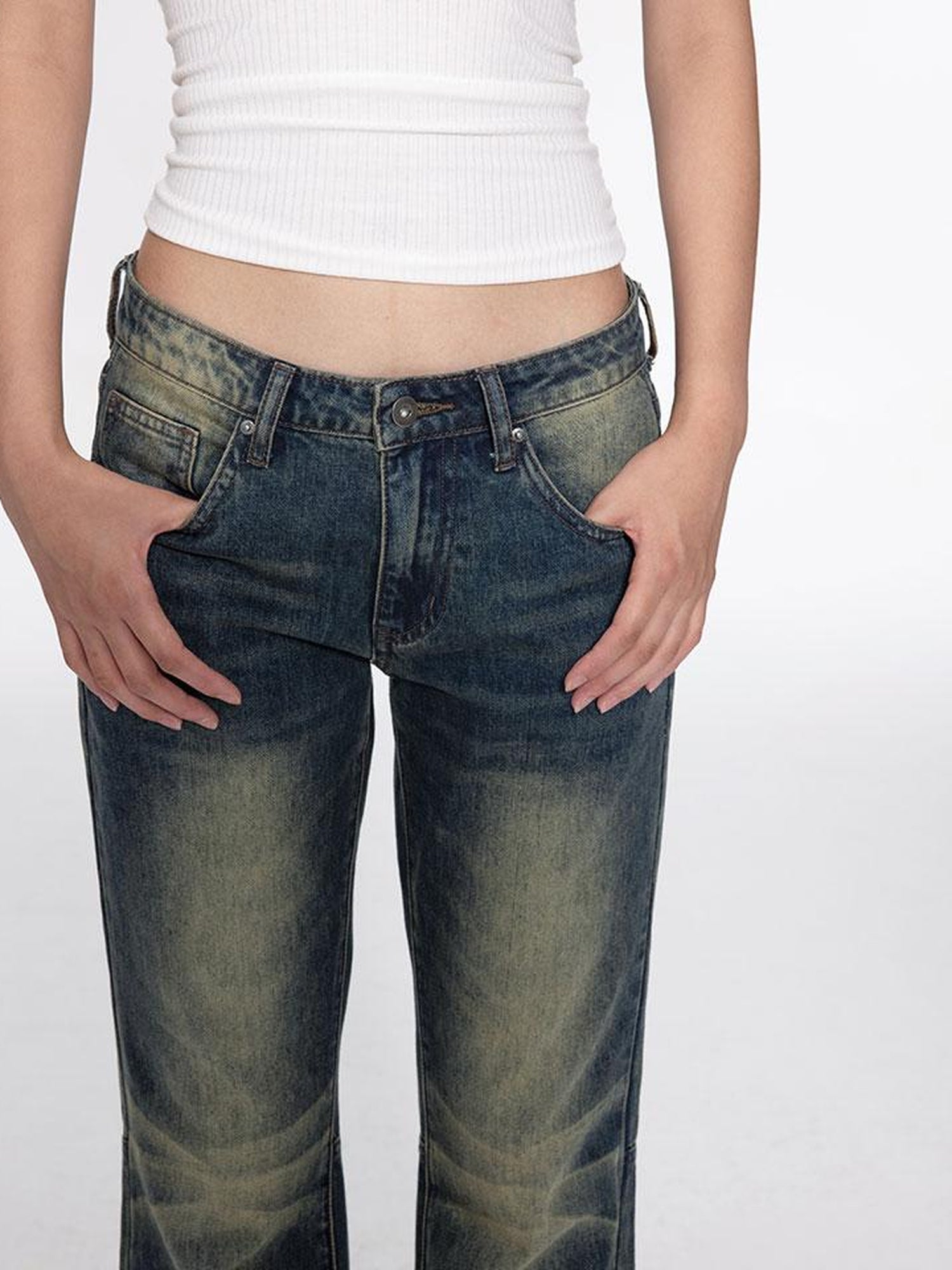 oinimi Low Rise Flared Jeans With Stacked Hem