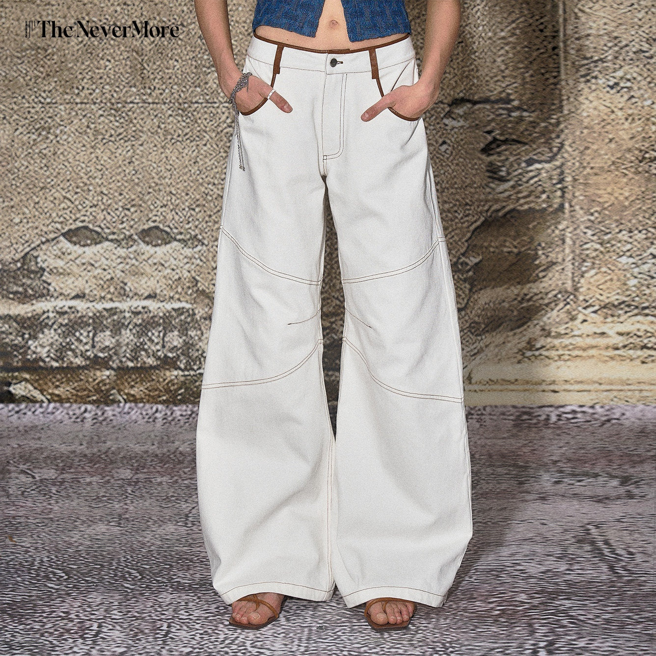 The NeverMore High Cotton Relaxed Distressed Low Rise White Denim Women Wide Leg Jeans