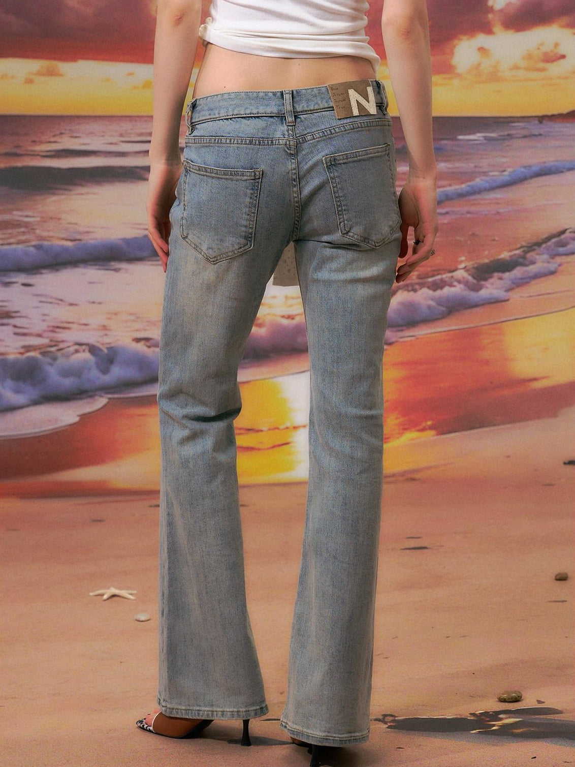 The NeverMore Durable Distressed Relaxed Low Rise Light Blue Denim Women Straight Leg Jeans