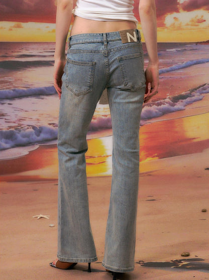 The NeverMore Durable Distressed Relaxed Low Rise Light Blue Denim Women Straight Leg Jeans