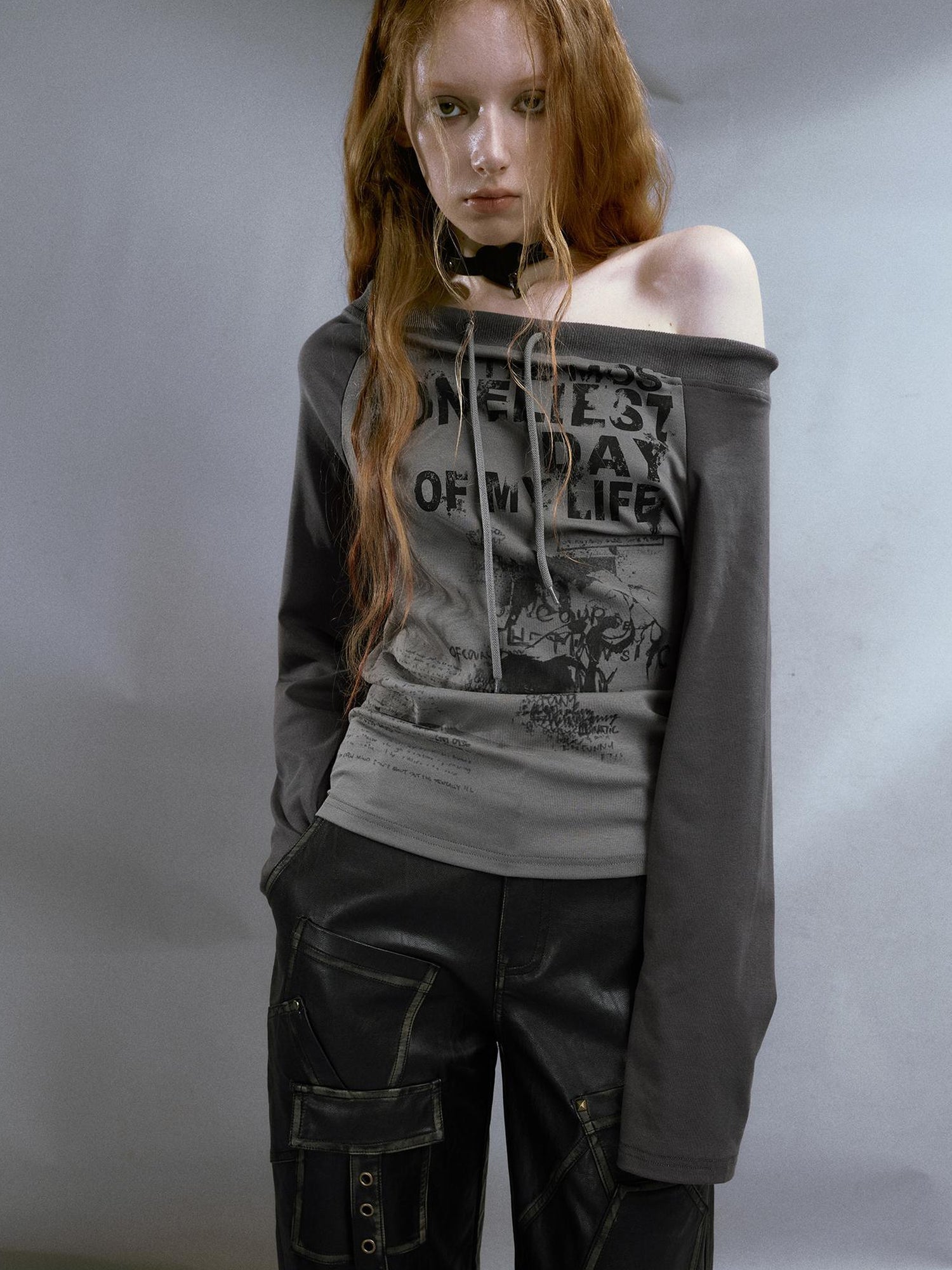 Cest Nous Run From Bad Love Asymmetrical Shoulder Graphic Knit Top