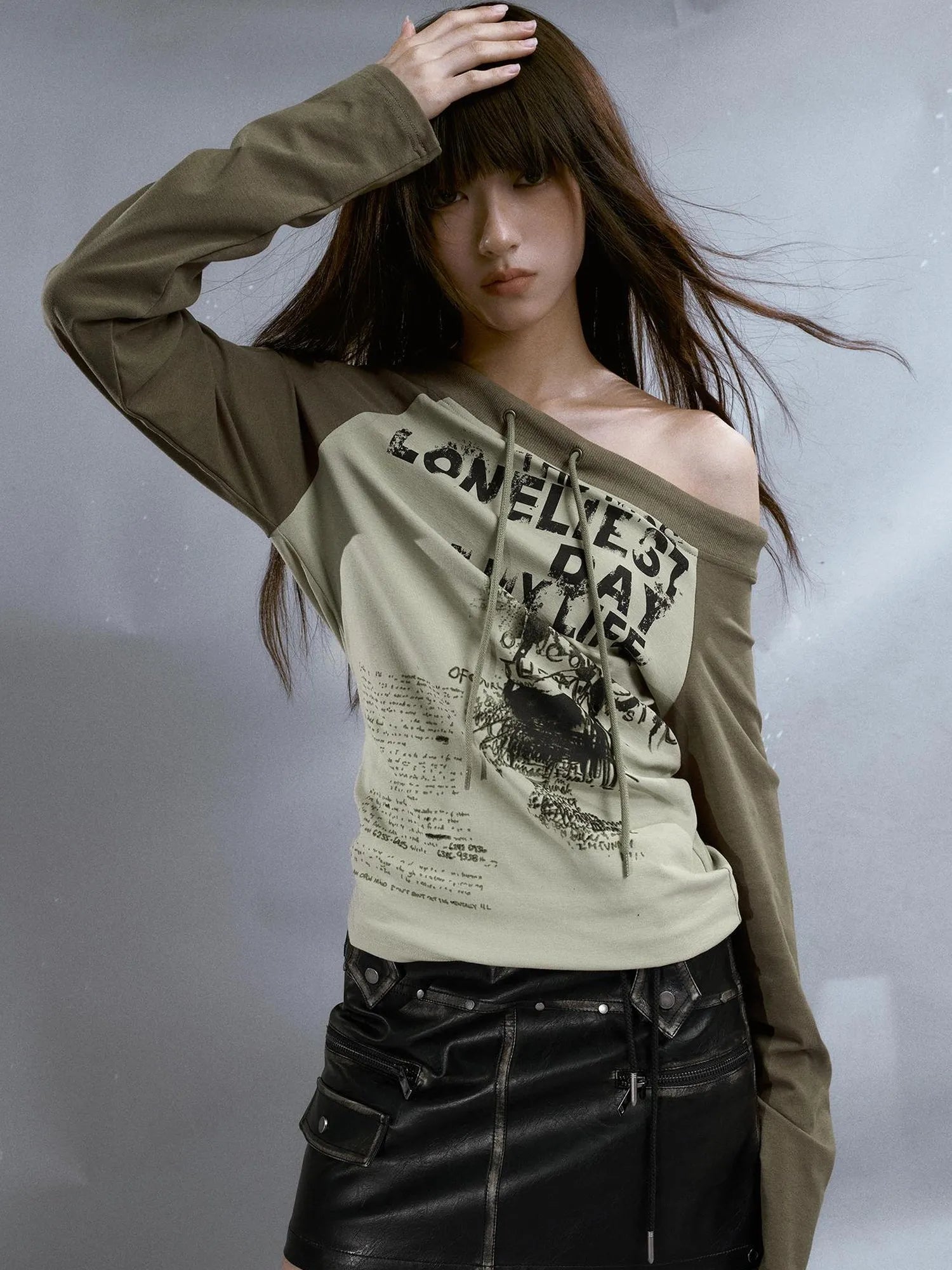 Run From Bad Love Asymmetrical Shoulder Graphic Knit Top