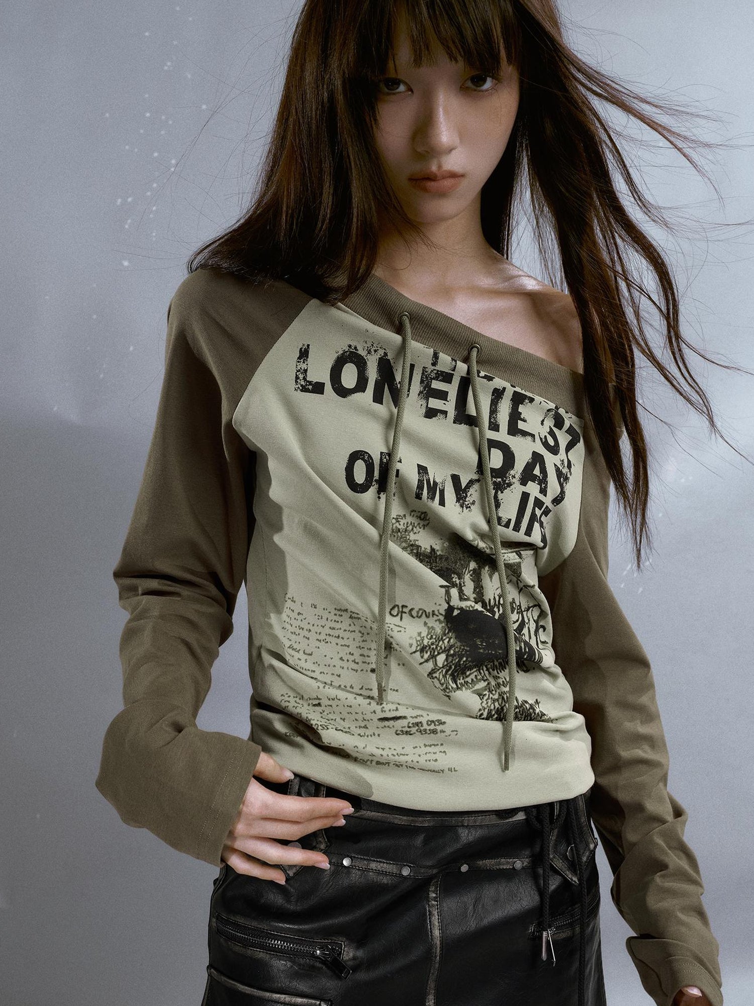 Cest Nous Run From Bad Love Asymmetrical Shoulder Graphic Knit Top