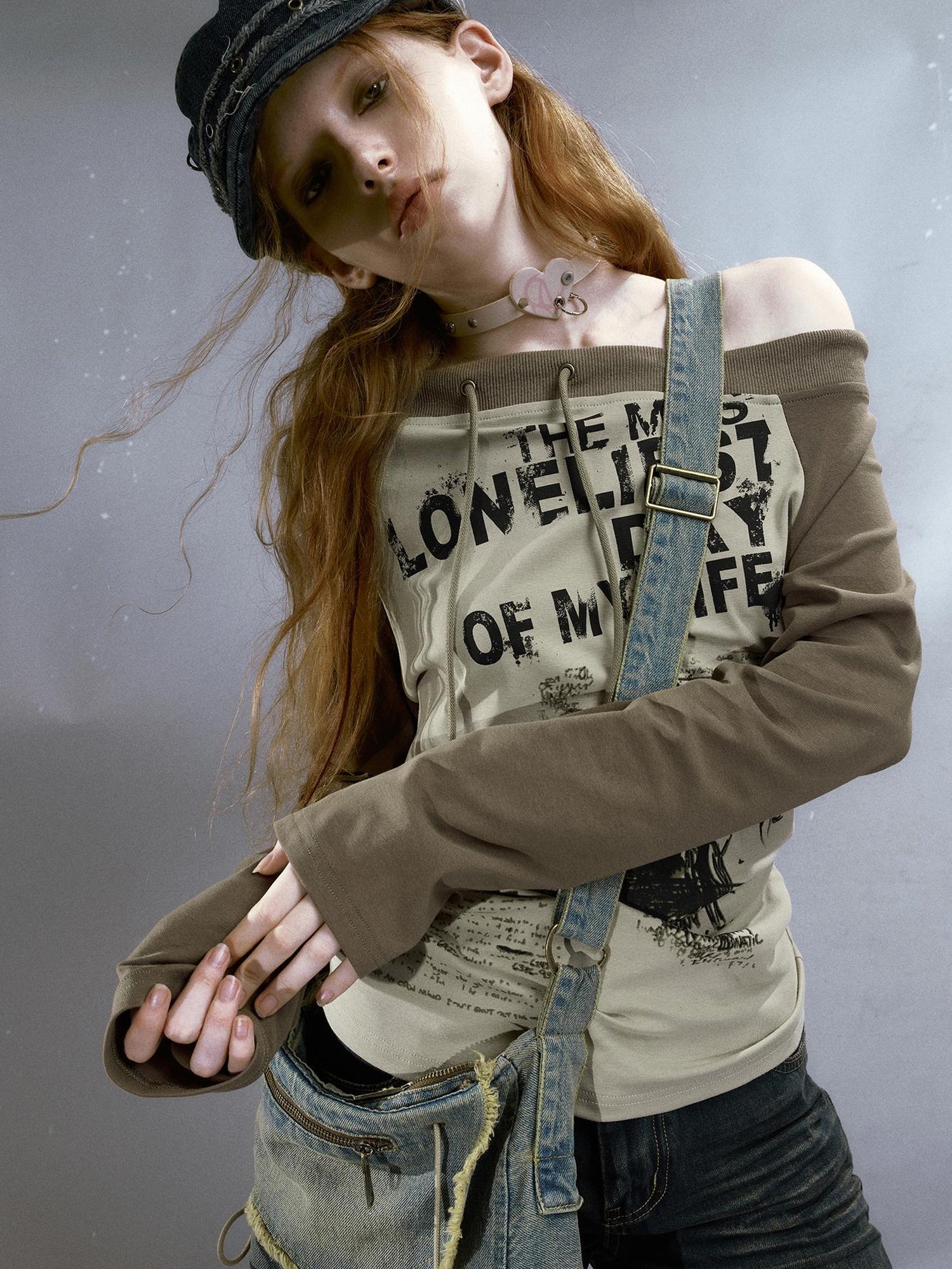 Cest Nous Run From Bad Love Asymmetrical Shoulder Graphic Knit Top