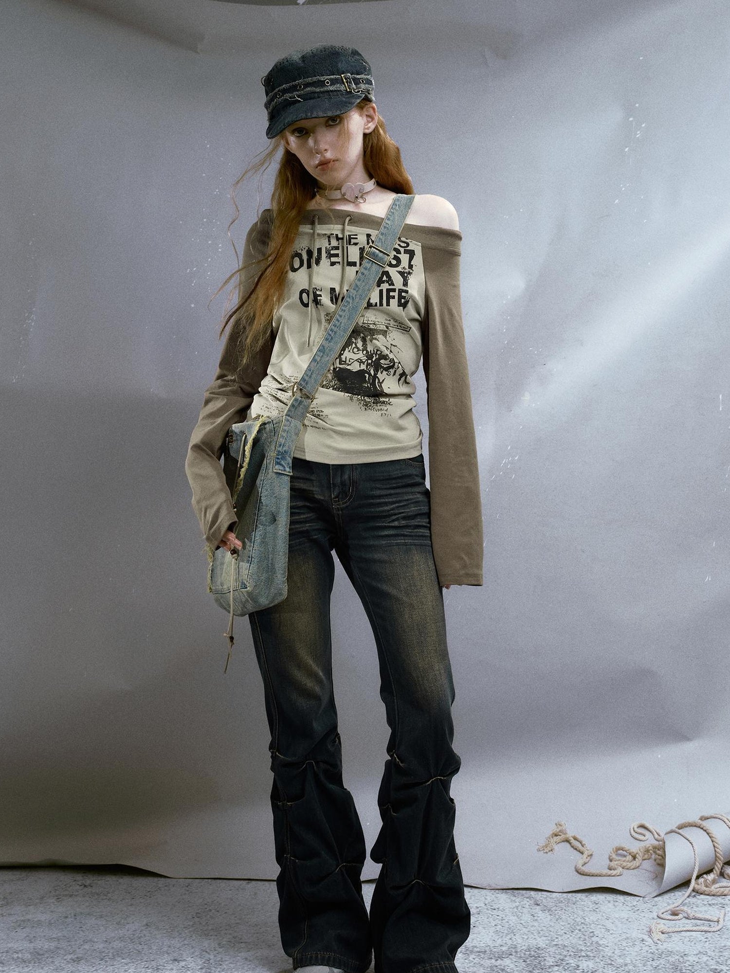 Cest Nous Run From Bad Love Asymmetrical Shoulder Graphic Knit Top