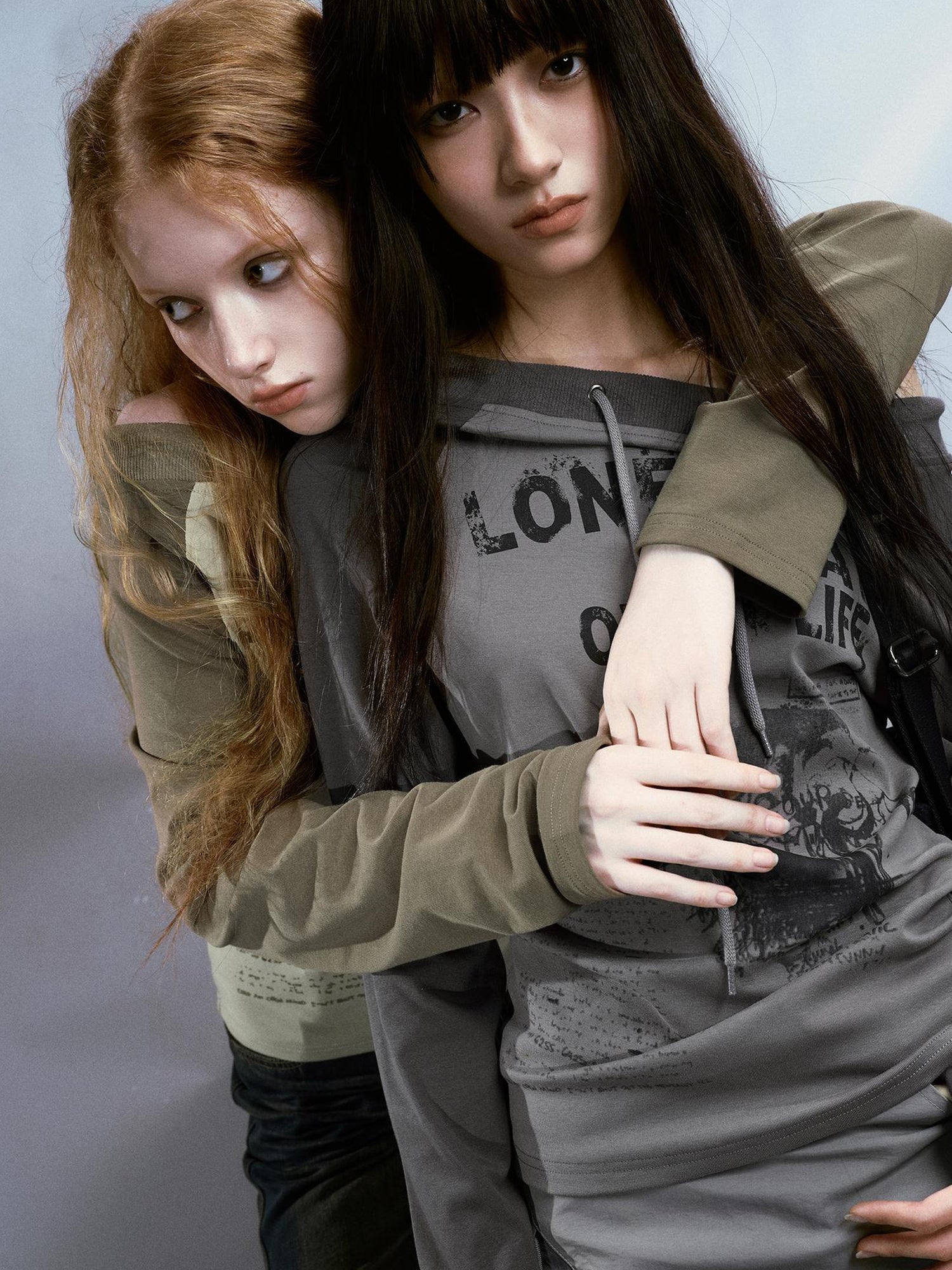 Cest Nous Run From Bad Love Asymmetrical Shoulder Graphic Knit Top