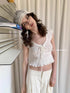 DKZ_OFFICIAL_Pleated_Sleeveless_T-shirt_With_Bow_Tie_And_Scalloped_Hem_MISSTT