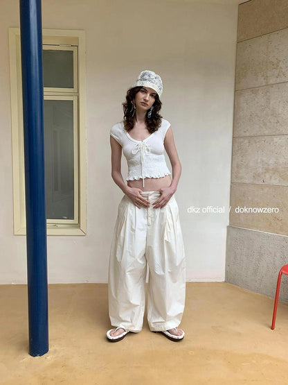 DKZ OFFICIAL Pleated Sleeveless T-shirt With Bow Tie And Scalloped Hem