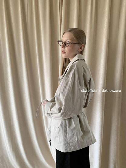DKZ OFFICIAL Stand Up Collar Drawstring Windbreaker With Multi Pockets