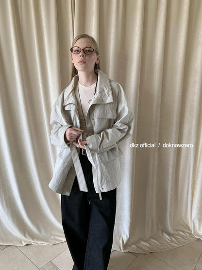 DKZ OFFICIAL Stand Up Collar Drawstring Windbreaker With Multi Pockets