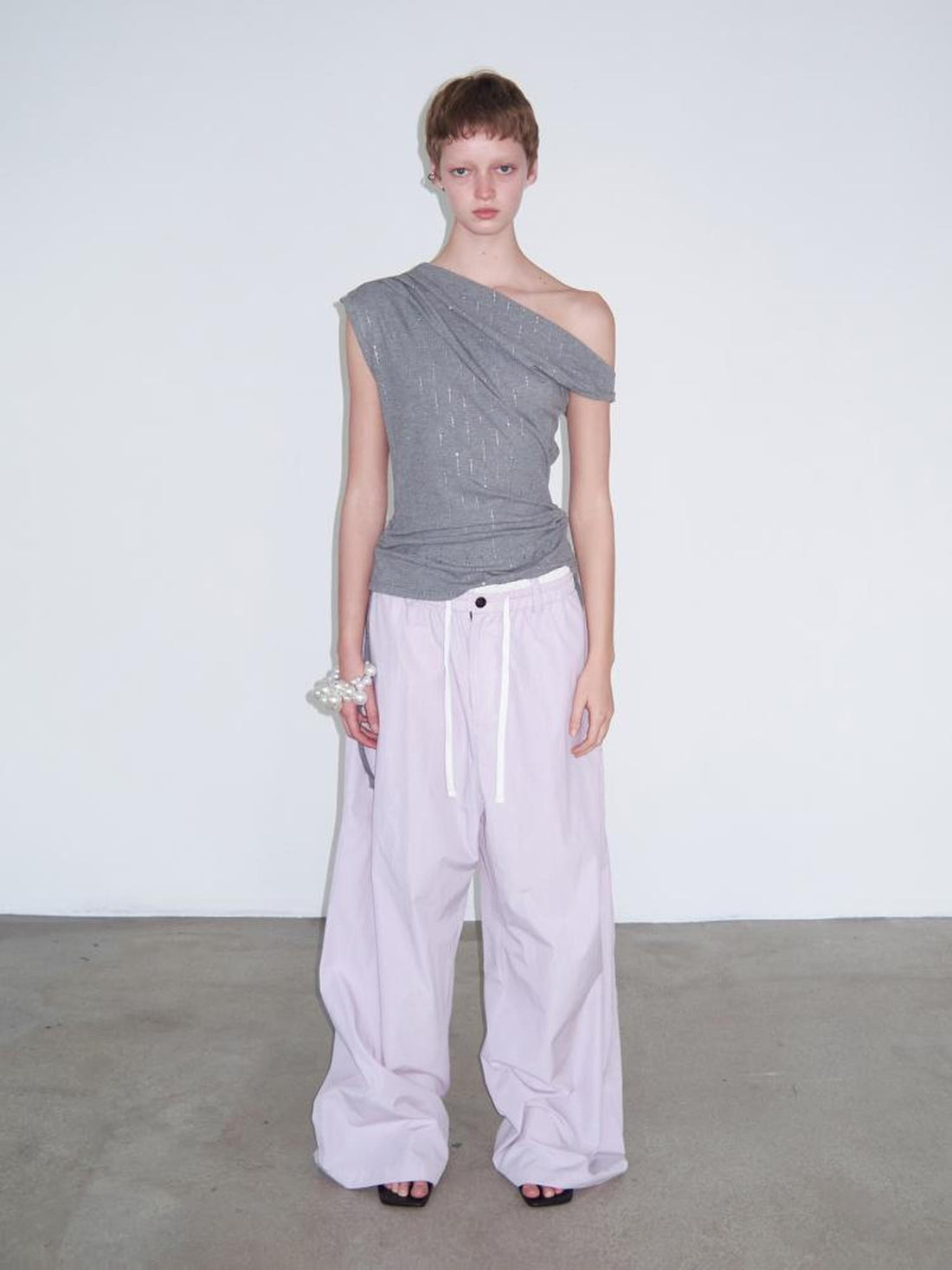 Delivery Asymmetric Shoulder Ruffle Top With Drawstring And Metallic Detail